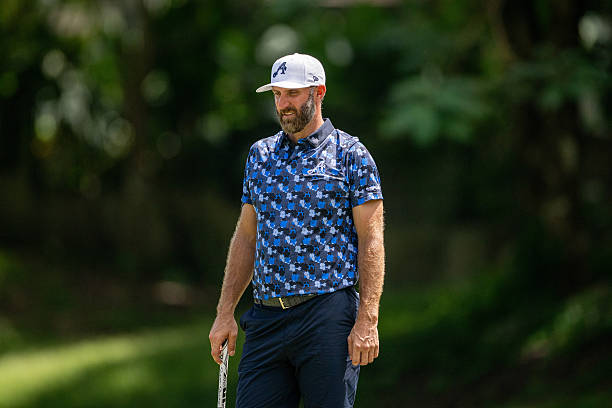 Dustin Johnson in Blue Camo Polo & Navy Trousers on the Golf Course