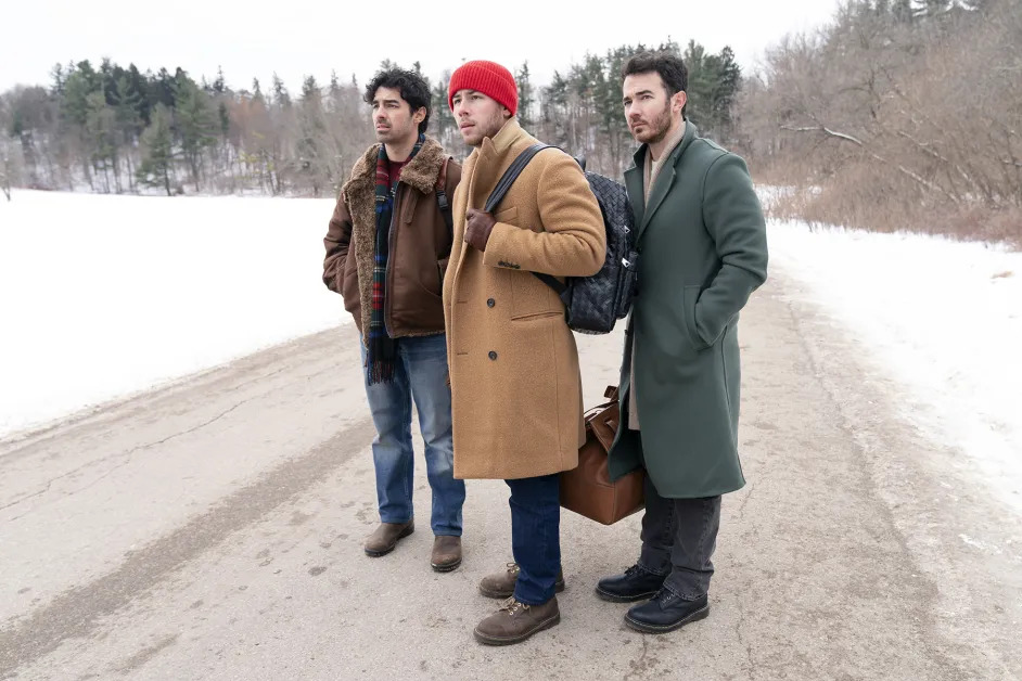 Joe, Kevin, and Nick Jonas show off their stunning winter outfits in A Very Jonas Christmas Movie, blending glamour, warmth, and holiday spirit.