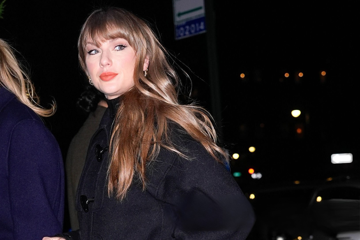 Taylor Swift wearing a black Louis Vuitton toggle coat during a celebrity sighting in New York City on December 9, 2025