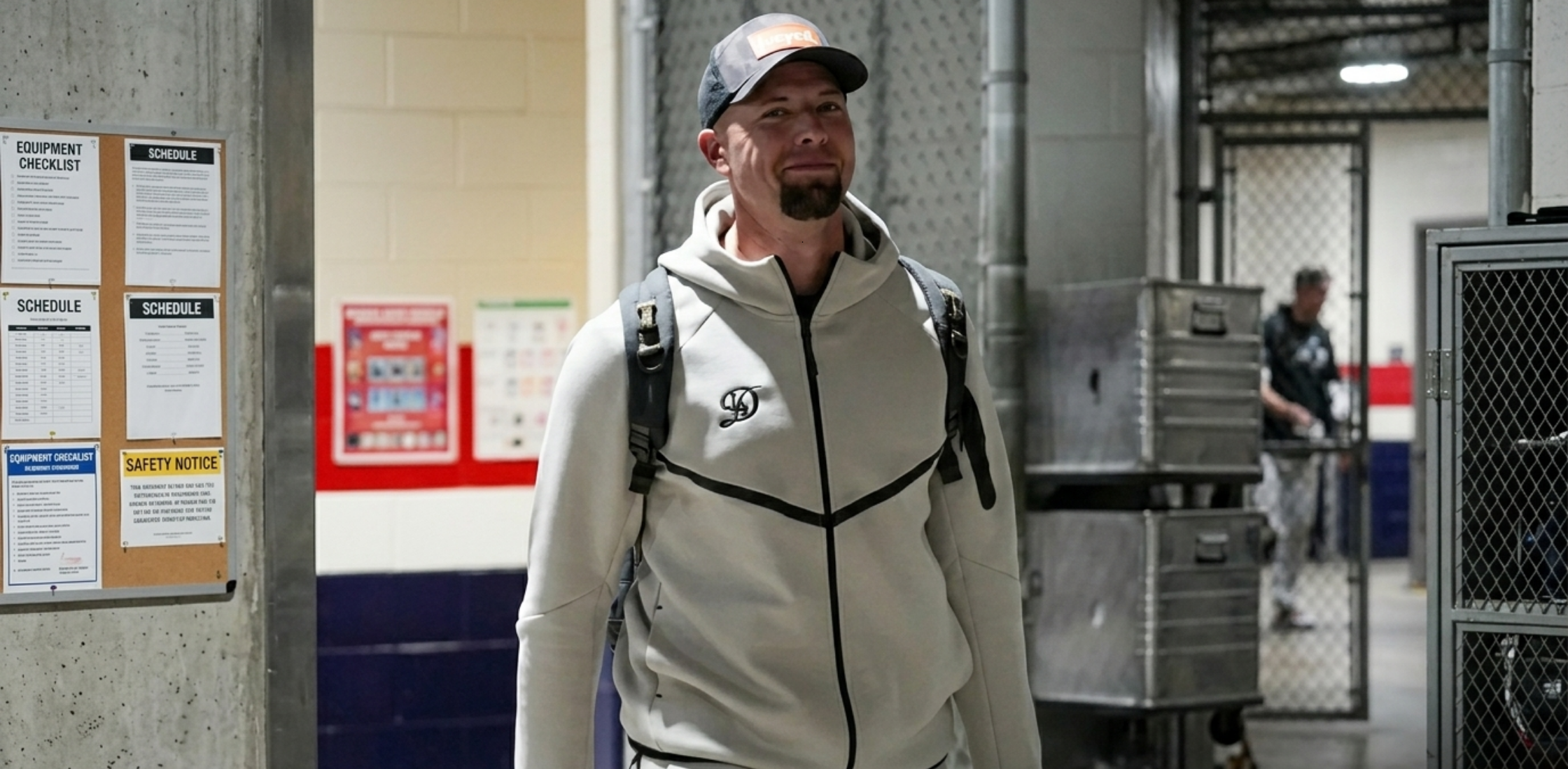 Los Angeles Dodgers 2026 tech fleece jacket in oatmeal grey with black accents, featuring “D” logo, zippered bicep pocket, and scuba-style hood.