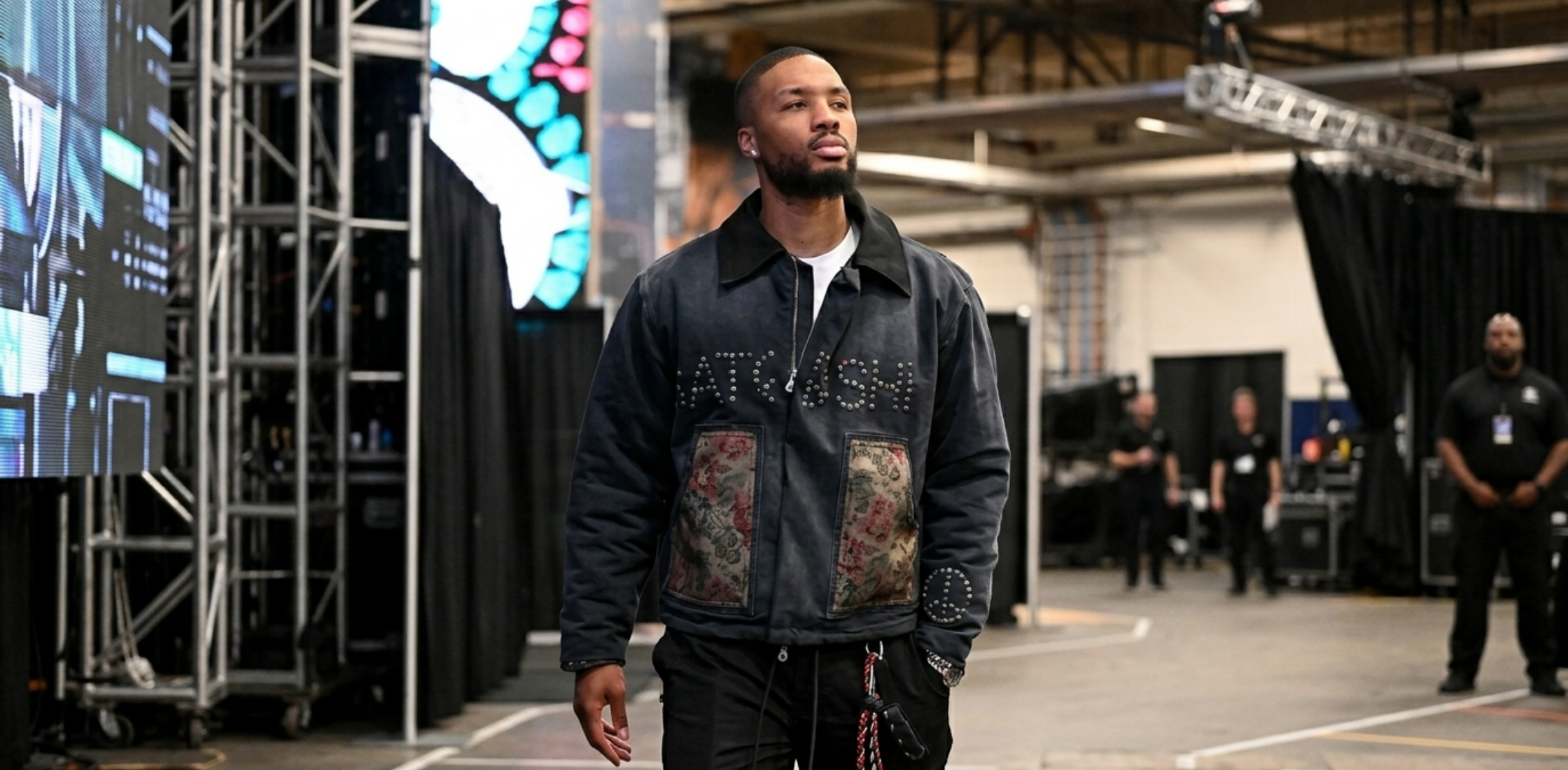 Damian Lillard Spurs vs Trail Blazers Game Two 2026 navy acid wash work jacket with corduroy collar, floral patch pockets, and studded chest design