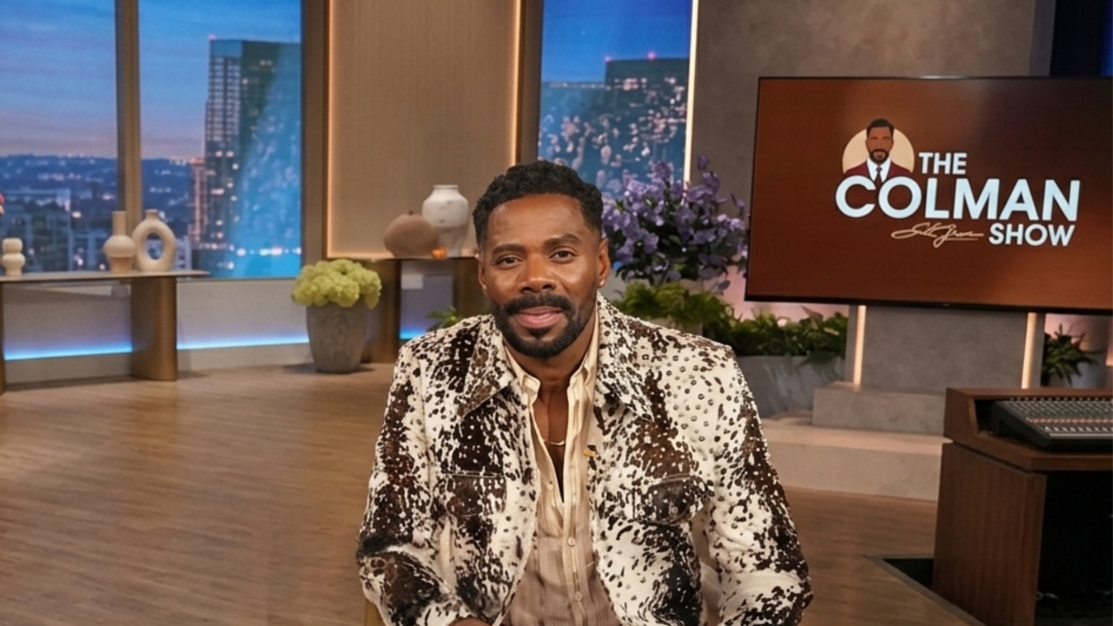 Colman Domingo wearing a cow hide print cropped western trucker jacket with silver studs, featuring a bold brown and white pattern and structured fit