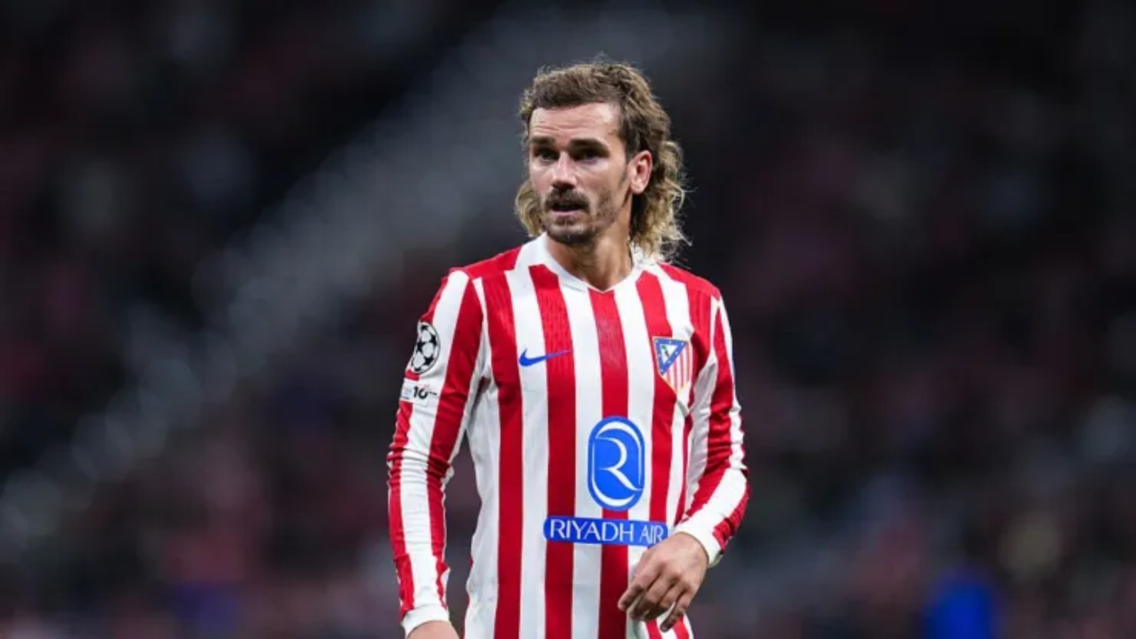 Antoine Griezmann FC Barcelona vs Atlético de Madrid red and white striped long sleeve jersey with club crest and sponsor detailing