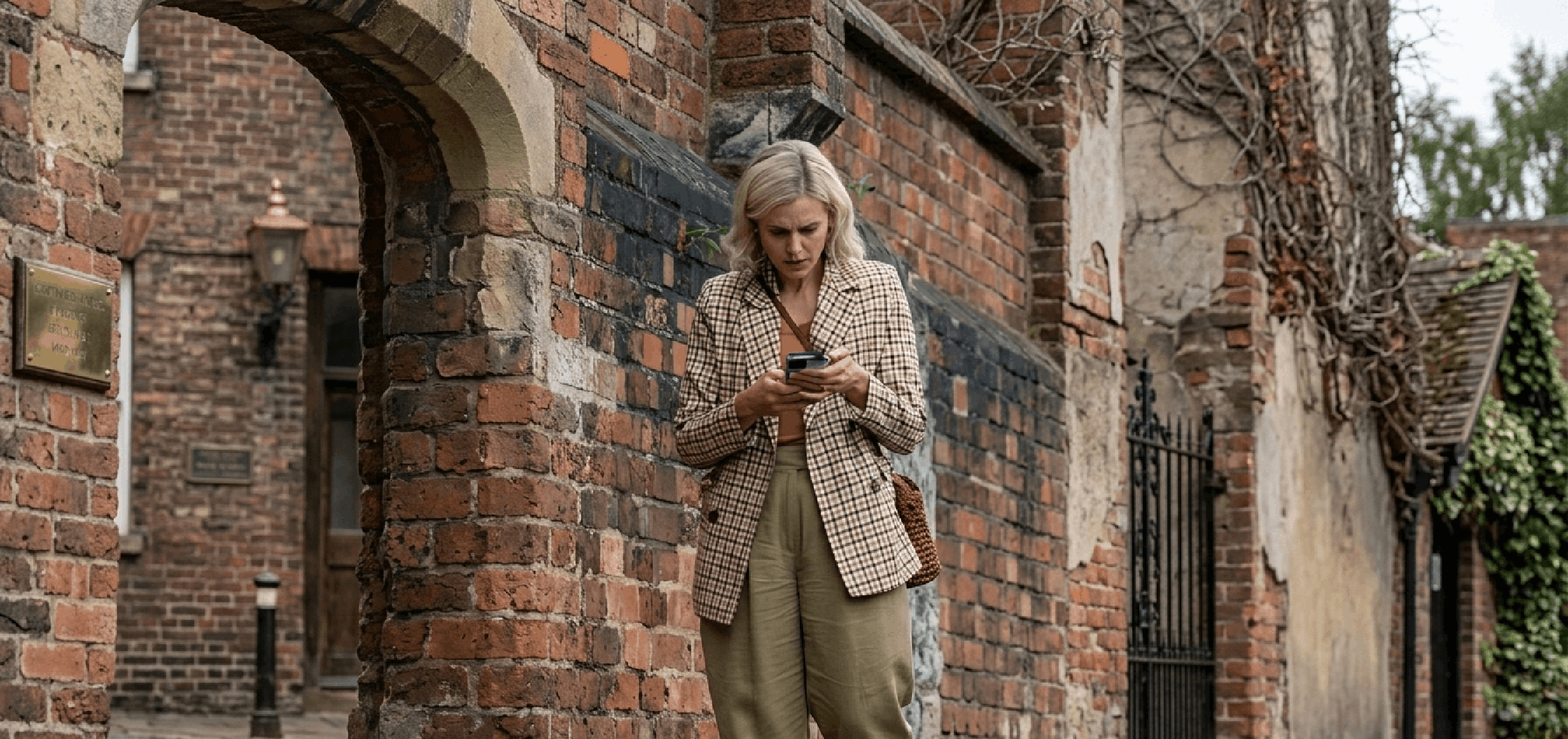 Denise Gough plaid blazer in The Stolen Girl 2025 with oversized fit and brown tattersall pattern