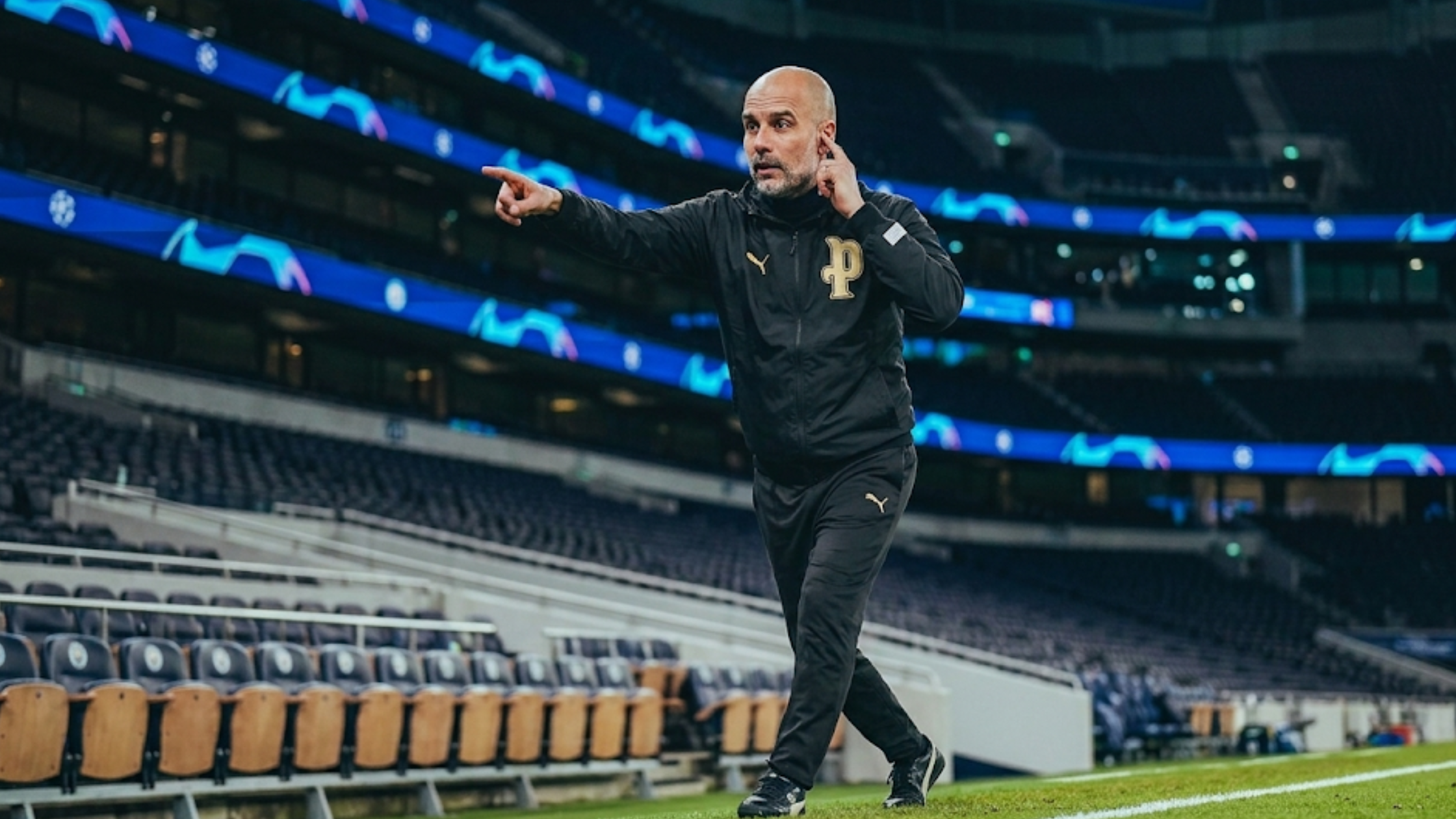 Josep Guardiola Burnley vs Manchester City 2026 black full-zip hoodie with gold Puma logo and monogram embroidery