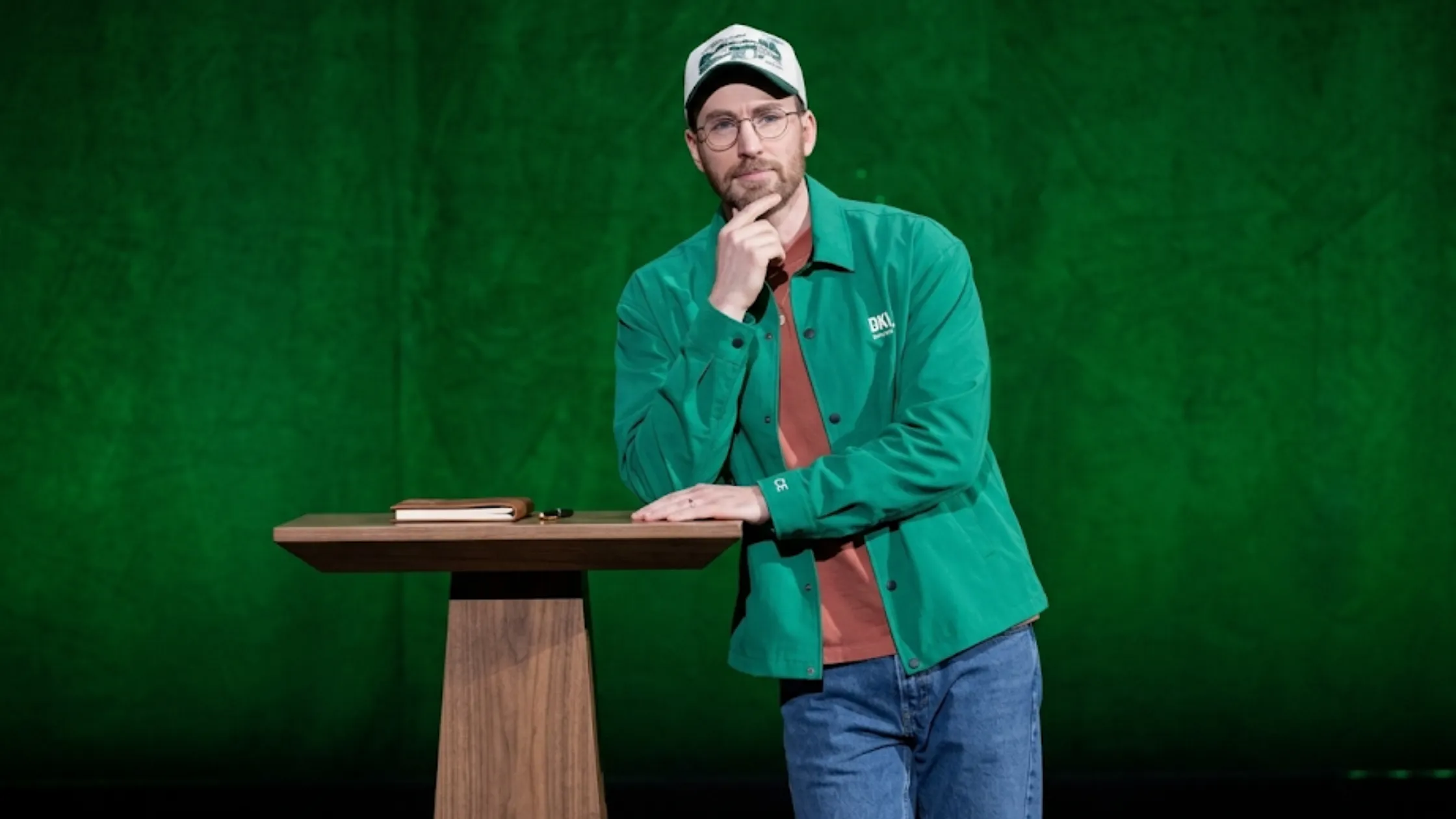 Chris Evans green coach jacket from Walt Disney Studios Presentation CinemaCon 2026 with DKN chest print and snap button closure