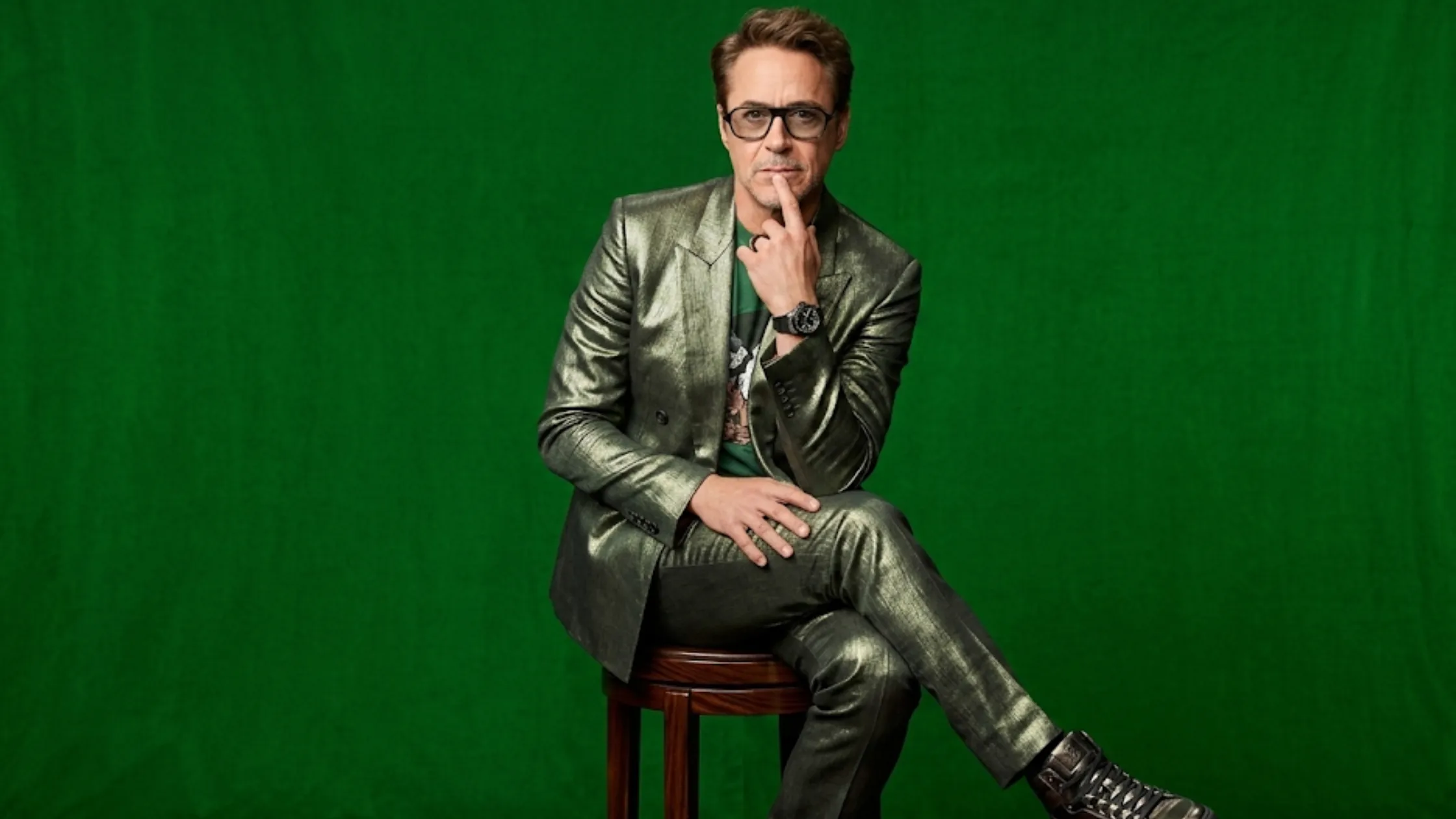 Robert Downey Jr. forest green metallic double-breasted suit with peak lapels and relaxed fit trousers at CinemaCon 2026 Walt Disney Studios appearance