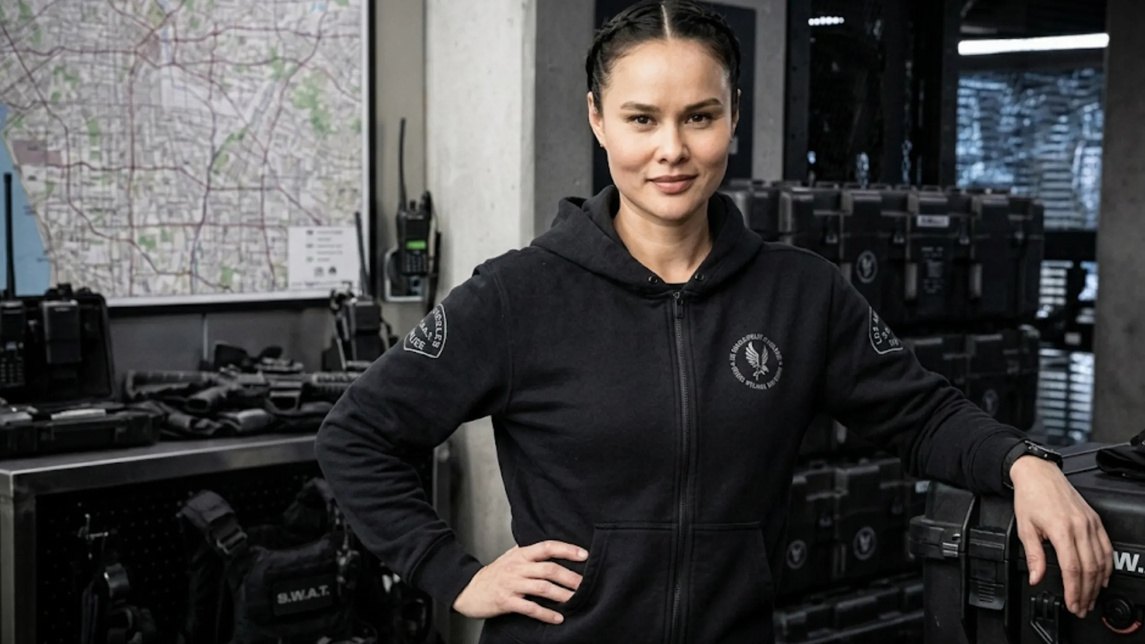 S.W.A.T S08 Zoe Powell black full-zip fleece hoodie with tactical insignia, eagle chest emblem, and relaxed fit design