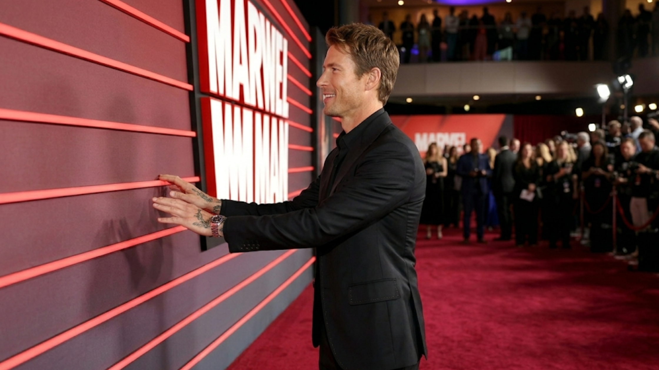 Glen Powell The Running Man UK Premiere black blazer with wide peaked lapels and red stitching detail