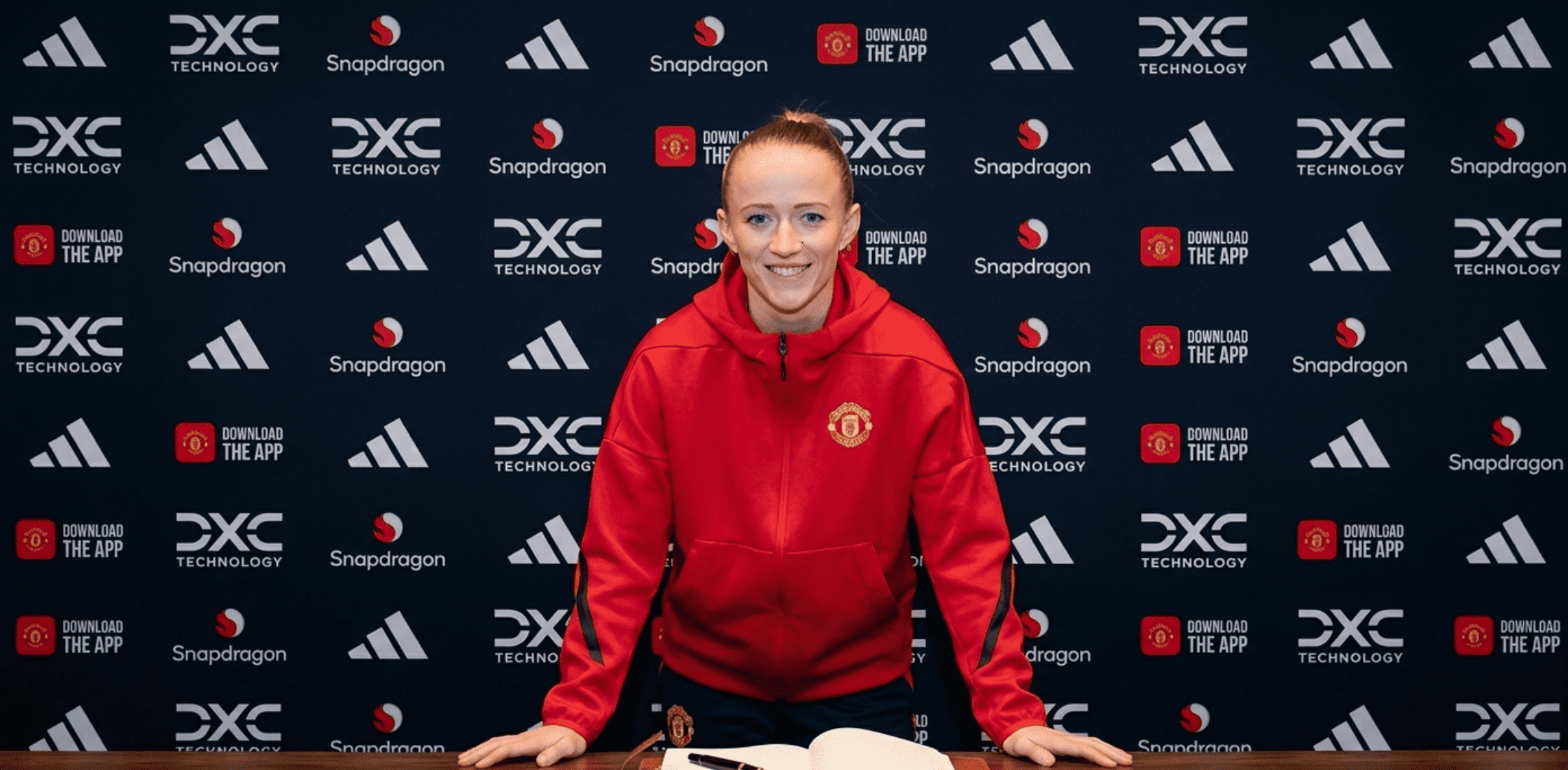 Lea Schüller Manchester United Women red oversized quarter-zip hoodie with club crest and adidas logo, featuring a modern boxy fit and athletic style