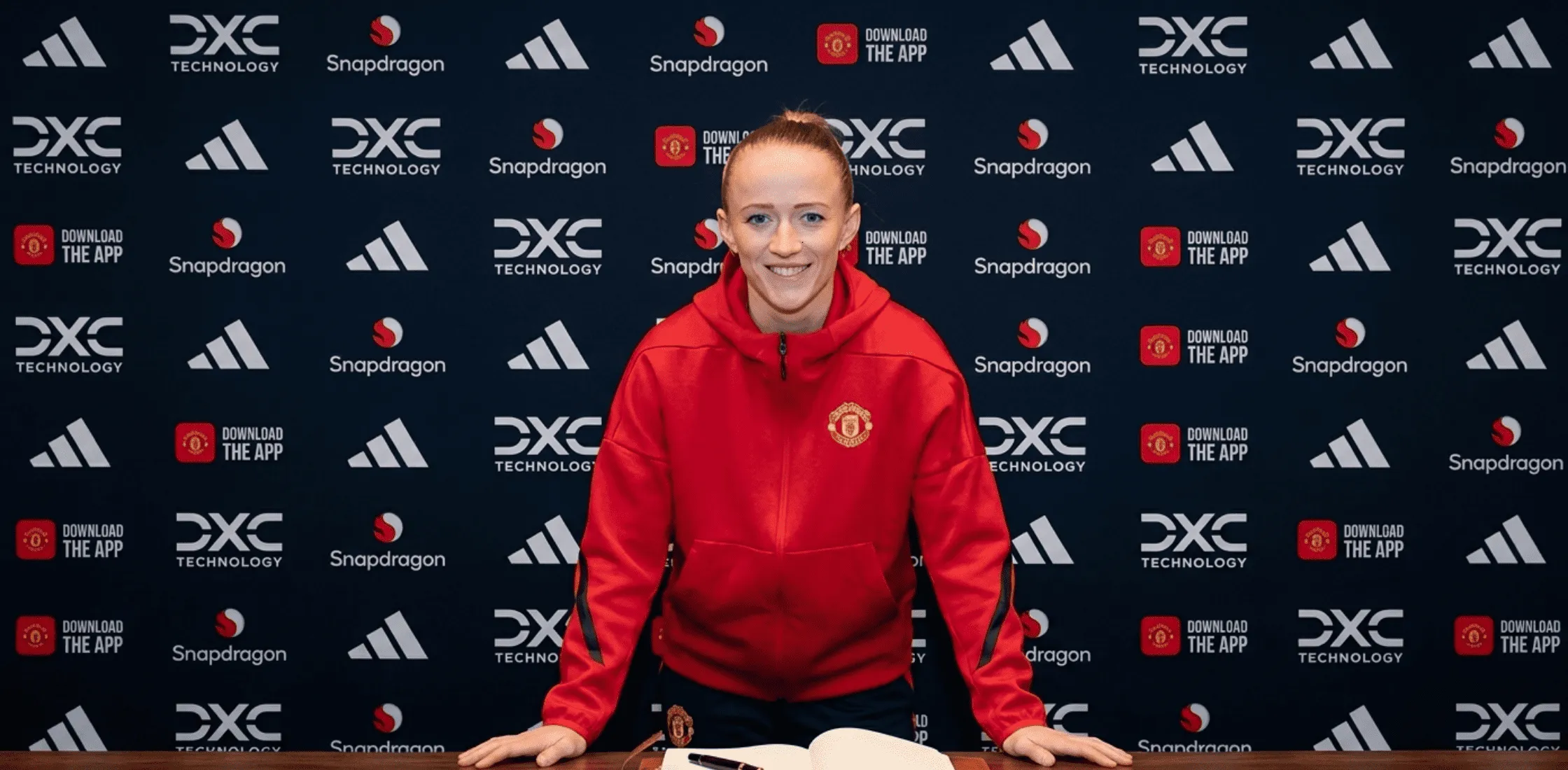 Lea Schüller Manchester United Women red oversized quarter-zip hoodie with club crest and adidas logo, featuring a modern boxy fit and athletic style