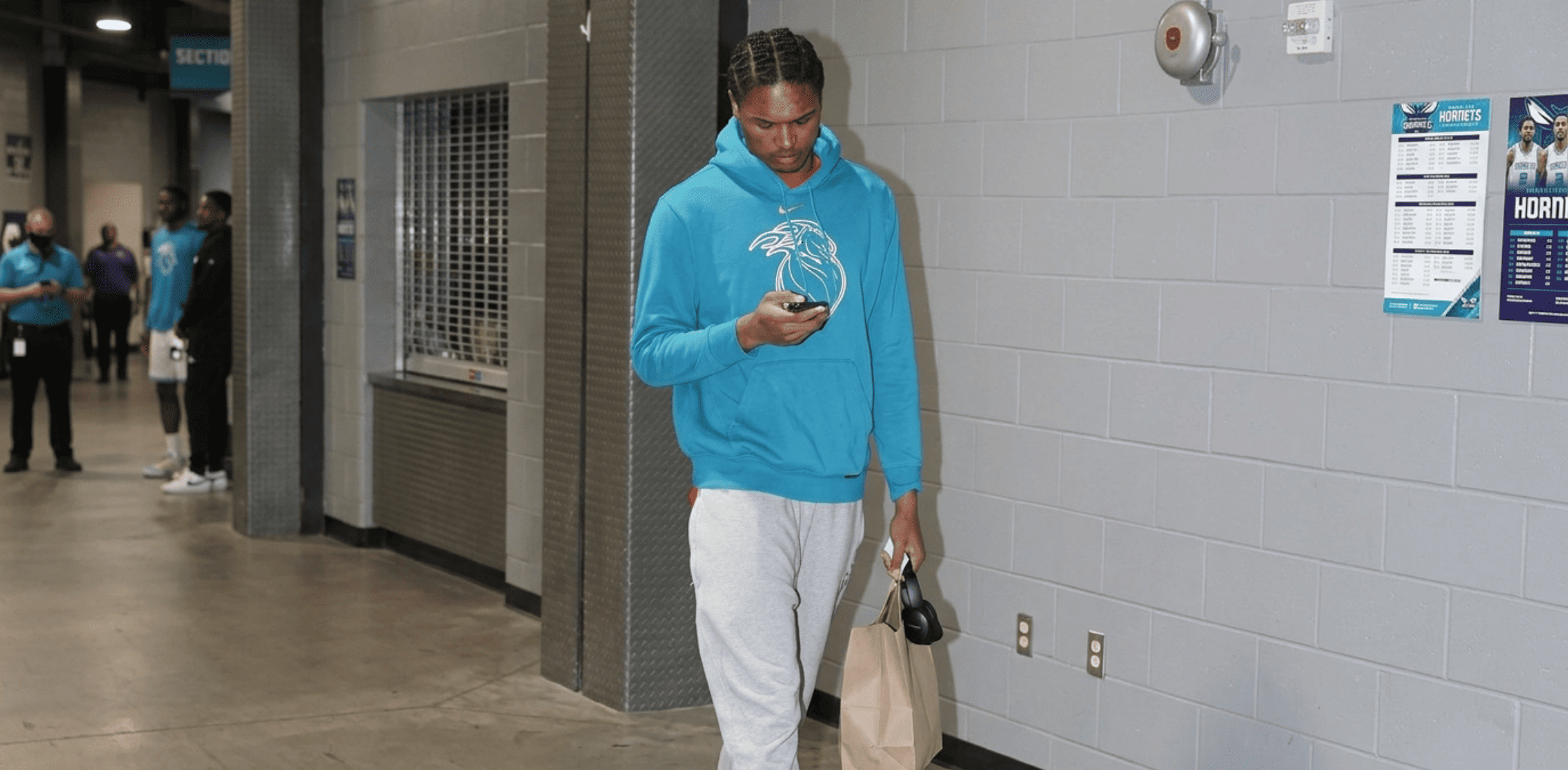 Ausar Thompson Detroit Pistons vs Charlotte Hornets Blue City Edition hoodie featuring teal color, cream chest graphic, Nike Swoosh branding, and NBA streetwear tunnel style design.