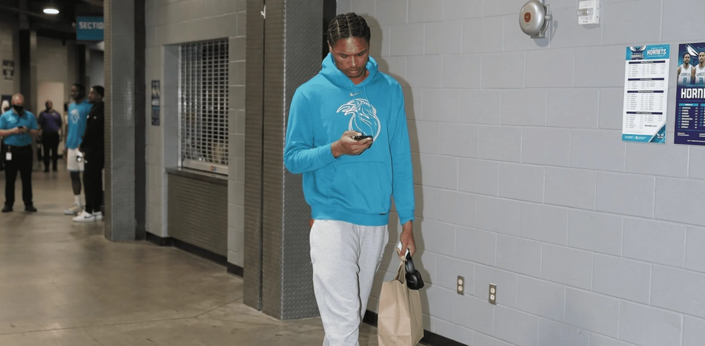 Ausar Thompson Detroit Pistons vs Charlotte Hornets Blue City Edition hoodie featuring teal color, cream chest graphic, Nike Swoosh branding, and NBA streetwear tunnel style design.