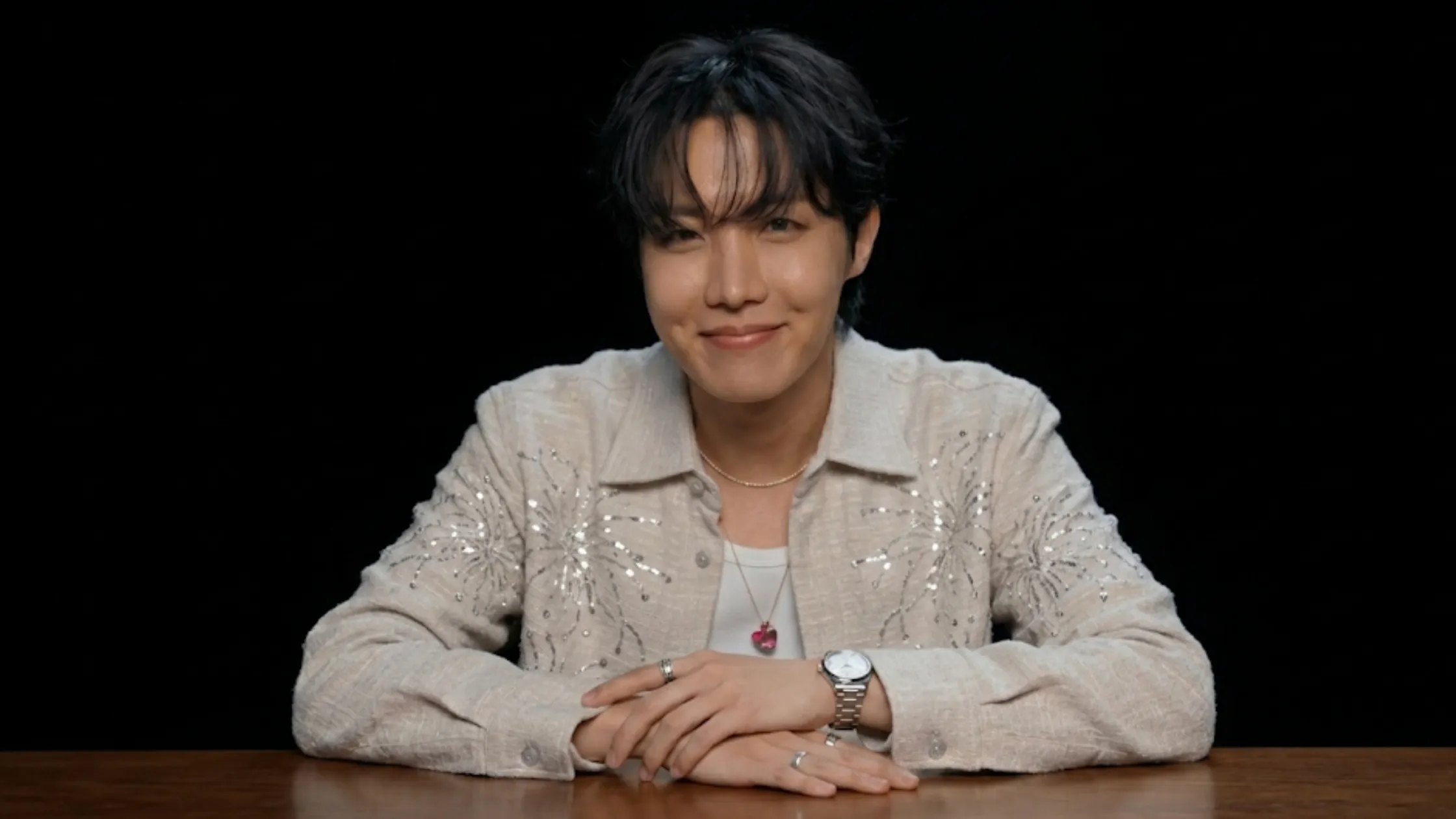 J-Hope Hot Ones beige overshirt jacket with silver firework embroidery and sequin detailing
