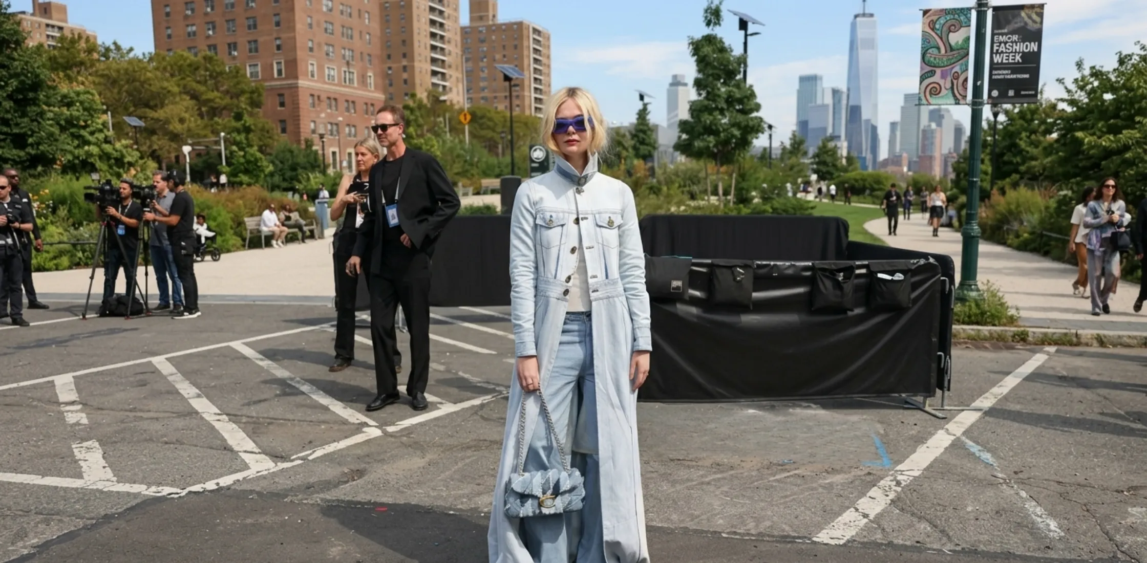 Elle Fanning wearing Coach 2025 blue denim long trench coat runway look at New York Fashion Week