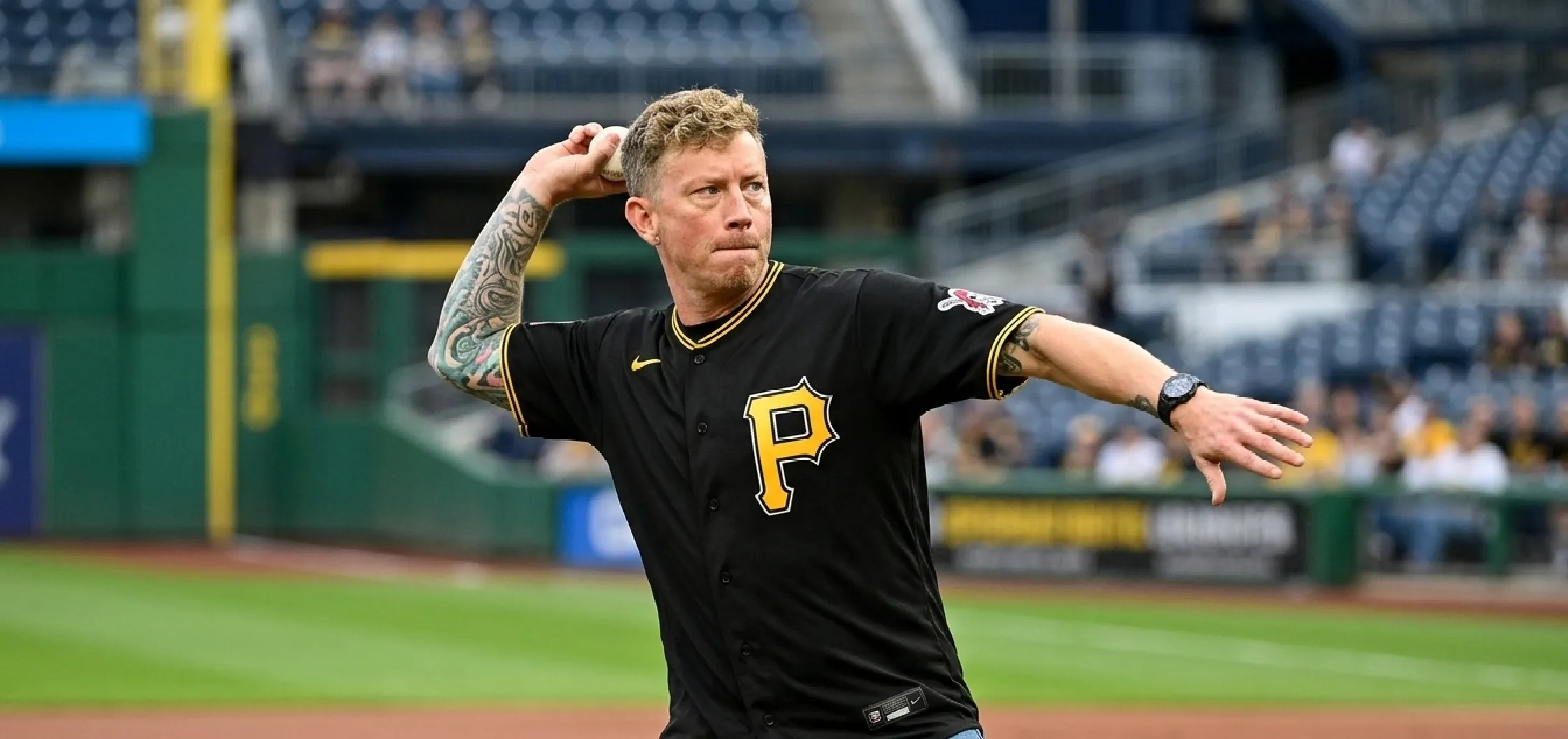 Pittsburgh Pirates Brooks Betts black baseball jersey with gold P logo, yellow piping, V-neck collar, and game-day streetwear styling