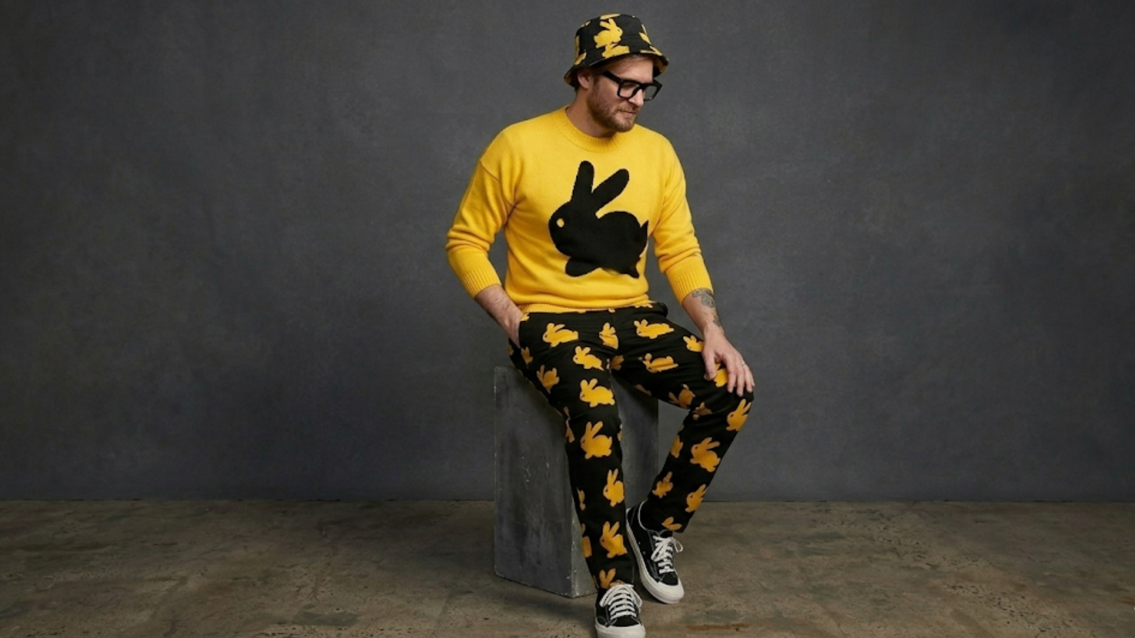 Bryan Fuller Dust Bunny yellow unisex sweatshirt with black rabbit graphic knit design