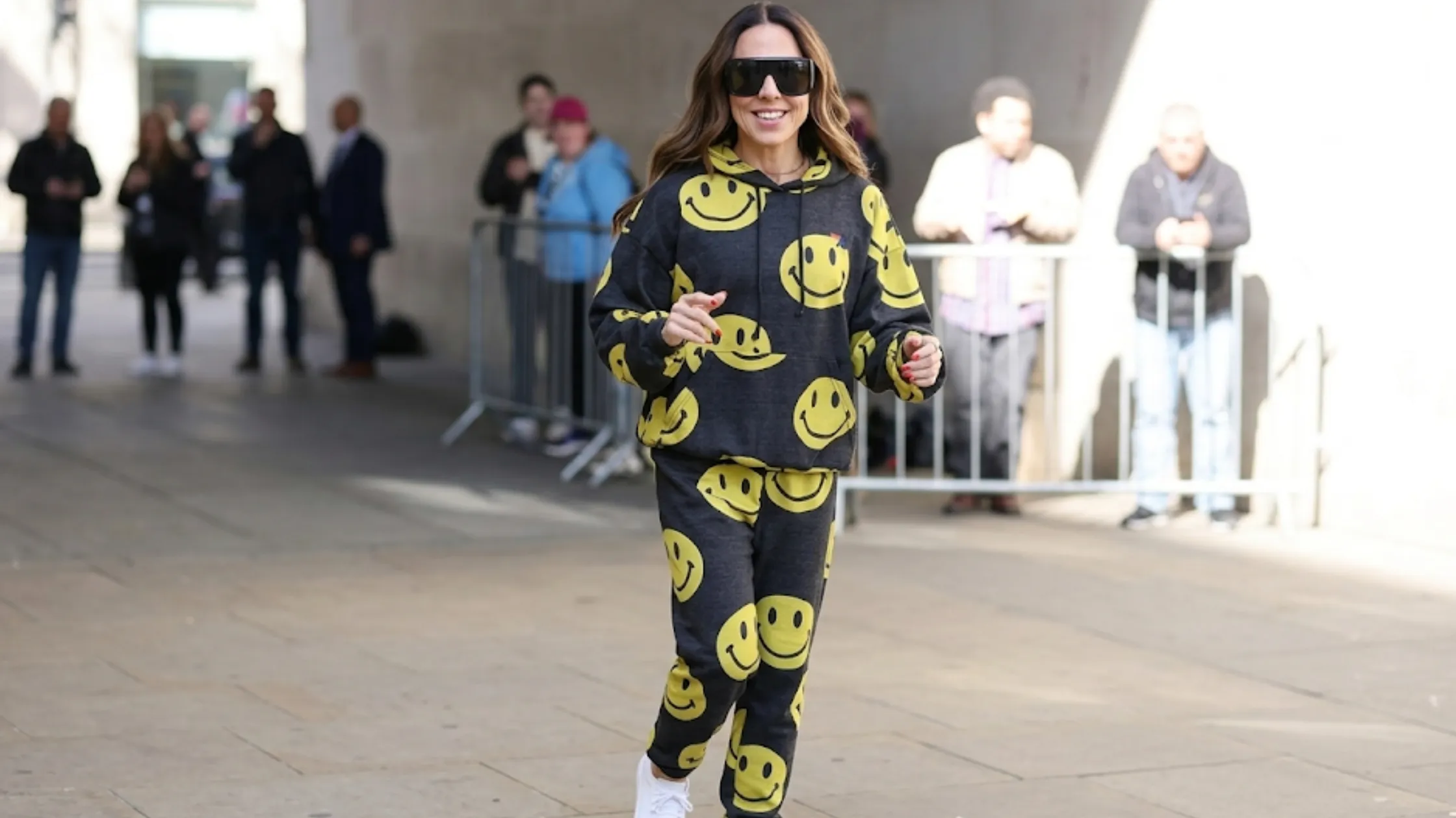 Melanie C BBC Radio 2 2026 charcoal grey oversized fleece hoodie with yellow smiley face print and kangaroo pocket