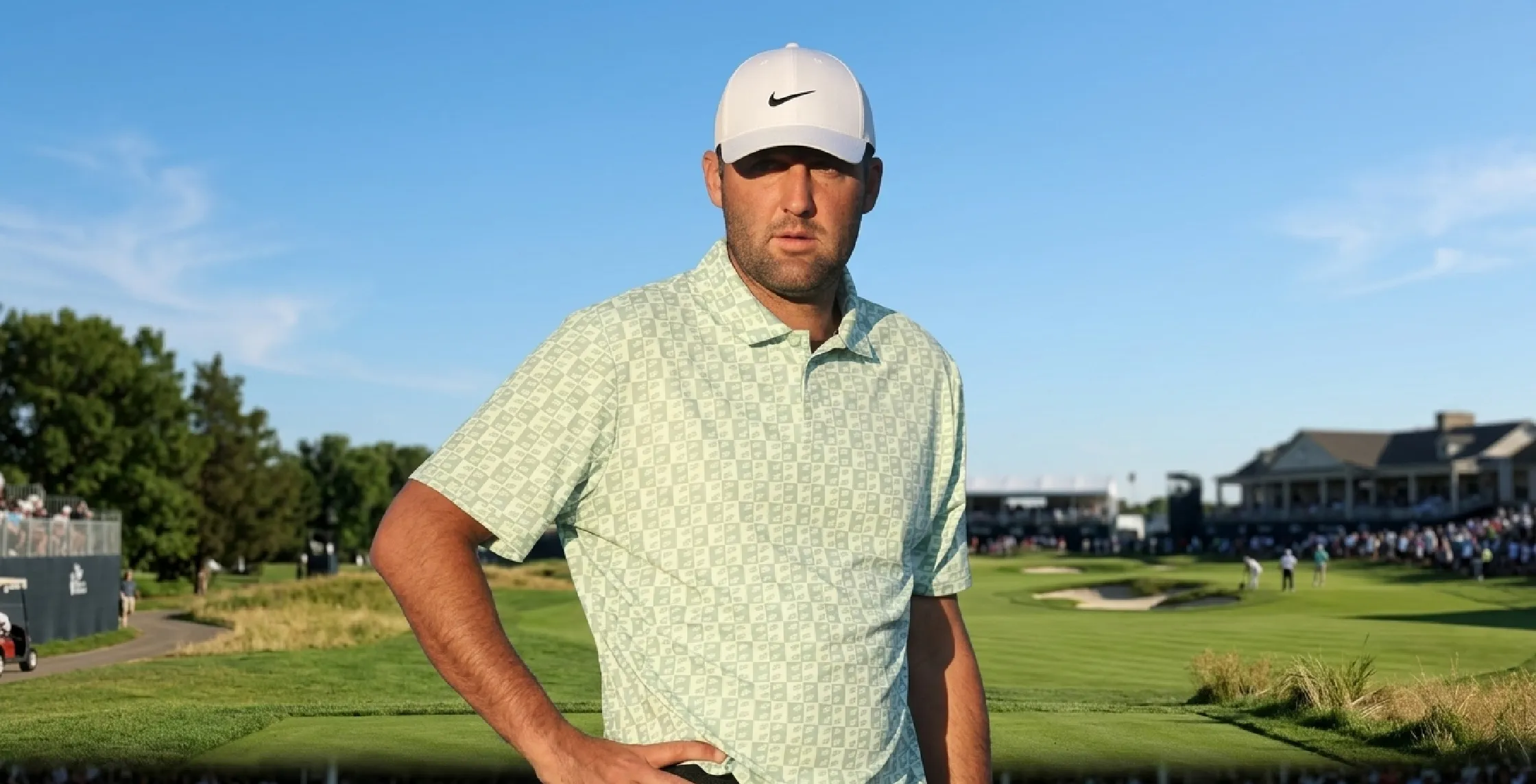 Scottie Scheffler wearing a mint green geometric checker print performance polo shirt at The Masters 2026 at Augusta National Golf Club