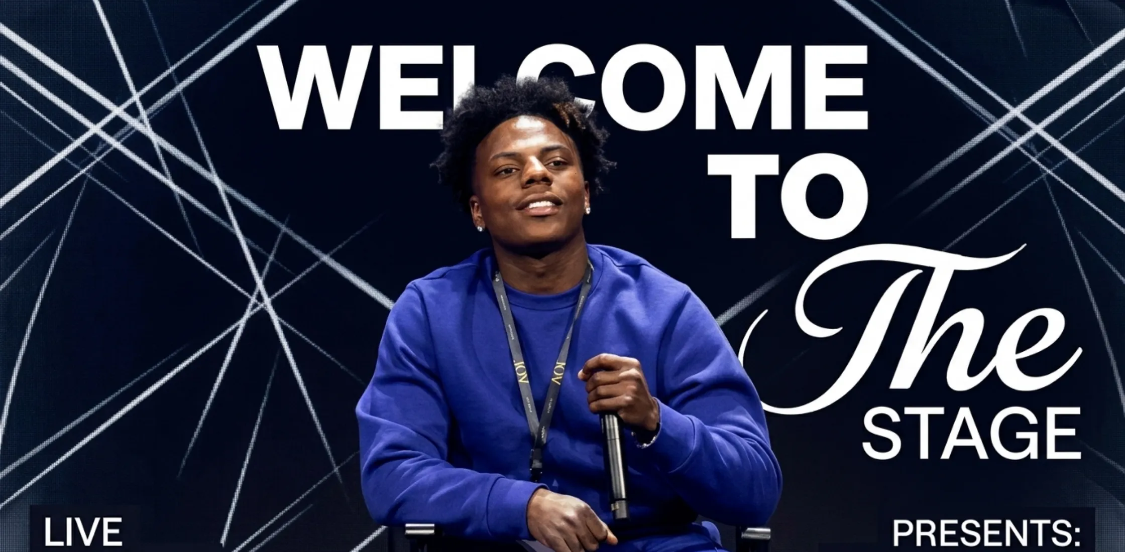 IShowSpeed wearing royal blue Joy Forum sweatshirt with matching track pants during live stage appearance at 2025 event
