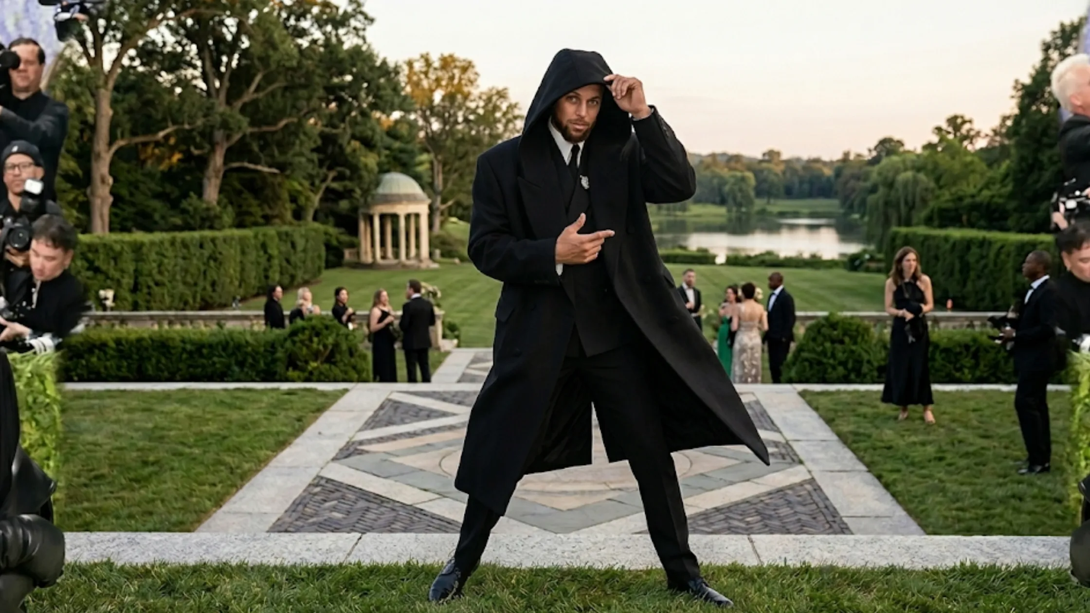 Stephen Curry 2026 Met Gala oversized black hooded wool coat with double-breasted closure and peak lapel cinematic celebrity outfit