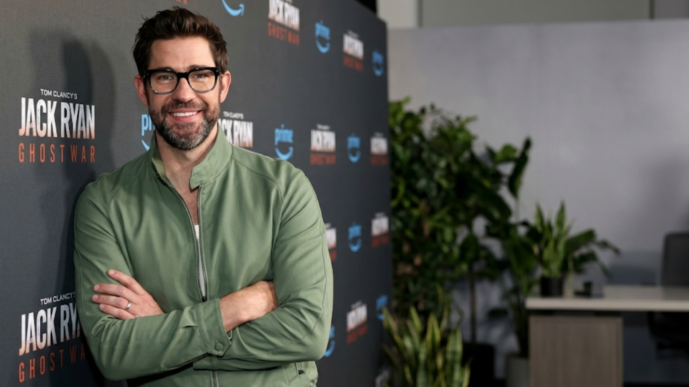 John Krasinski Jack Ryan Ghost War world premiere green Harrington jacket dual zip sage olive smart casual celebrity red carpet look