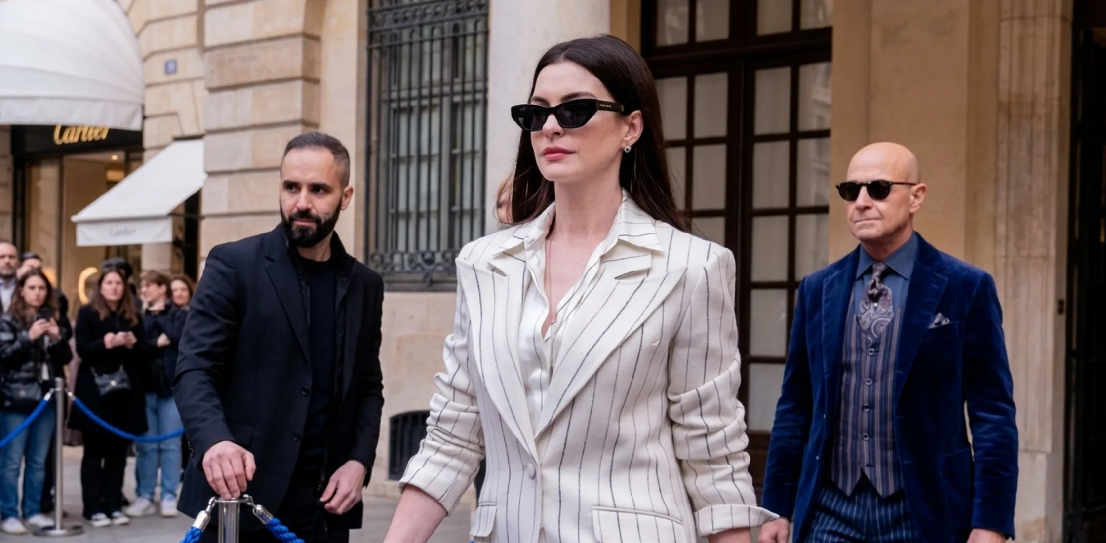 Anne Hathaway wearing pinstripe blazer in The Devil Wears Prada 2 showcasing modern power dressing style