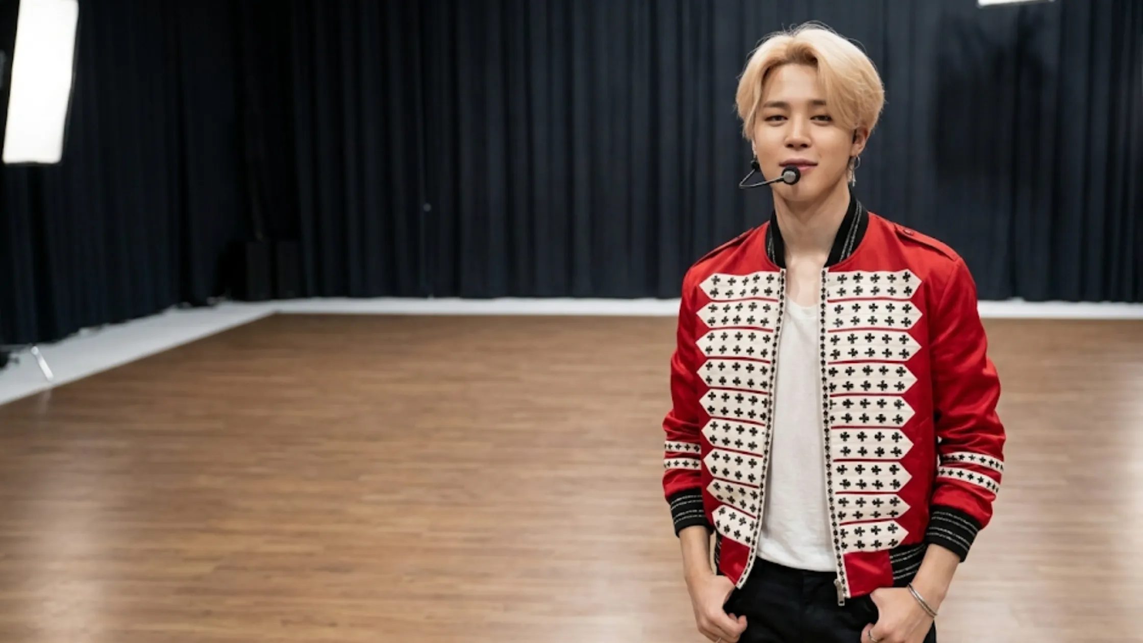 BTS Jimin crimson satin bomber jacket military inspired embroidery epaulettes ribbed trims luxury streetwear K-pop fashion statement