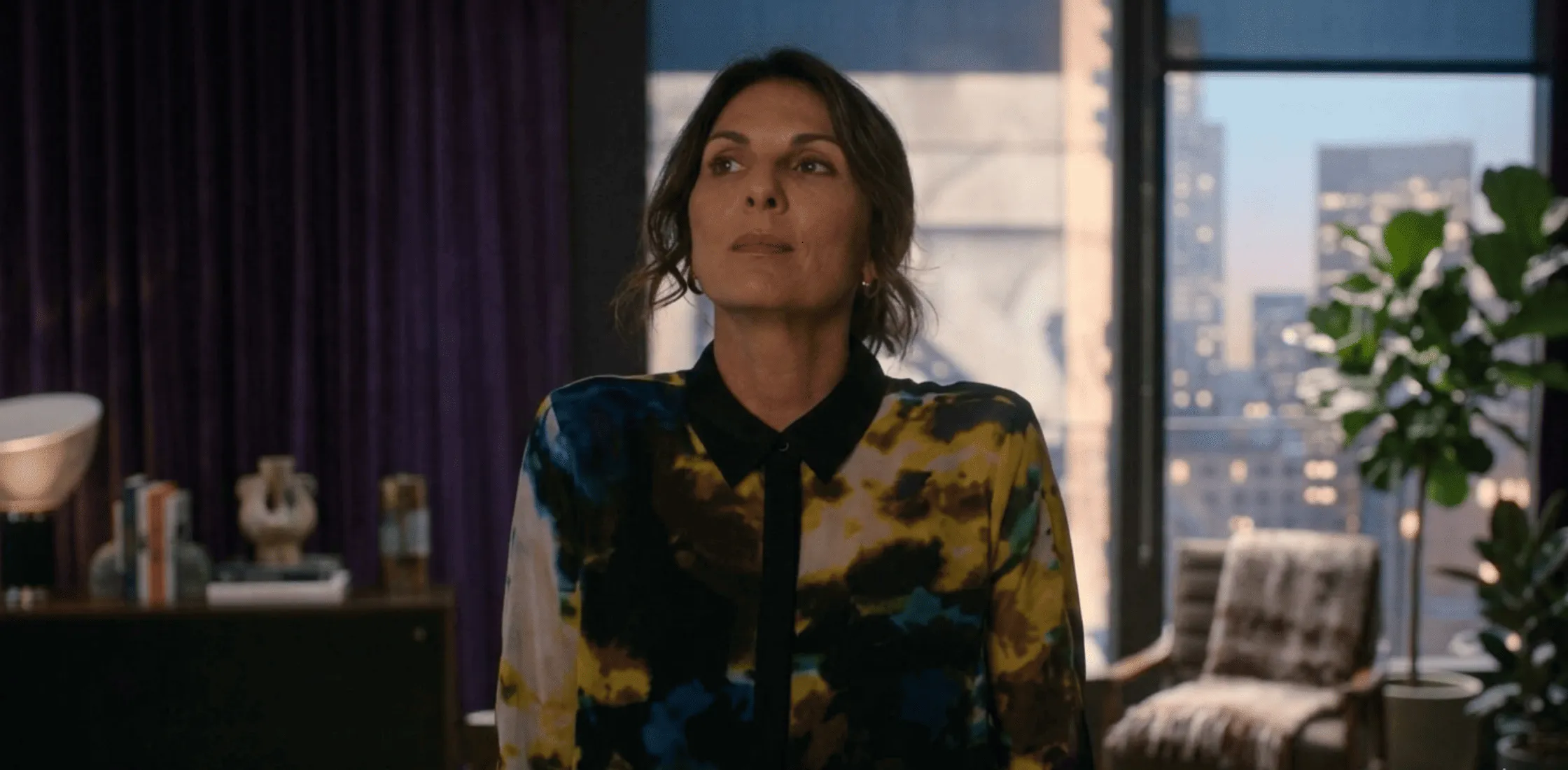 Leverage Redemption S03 Sophie Devereaux yellow and black printed shirt with abstract multicolor tie-dye design