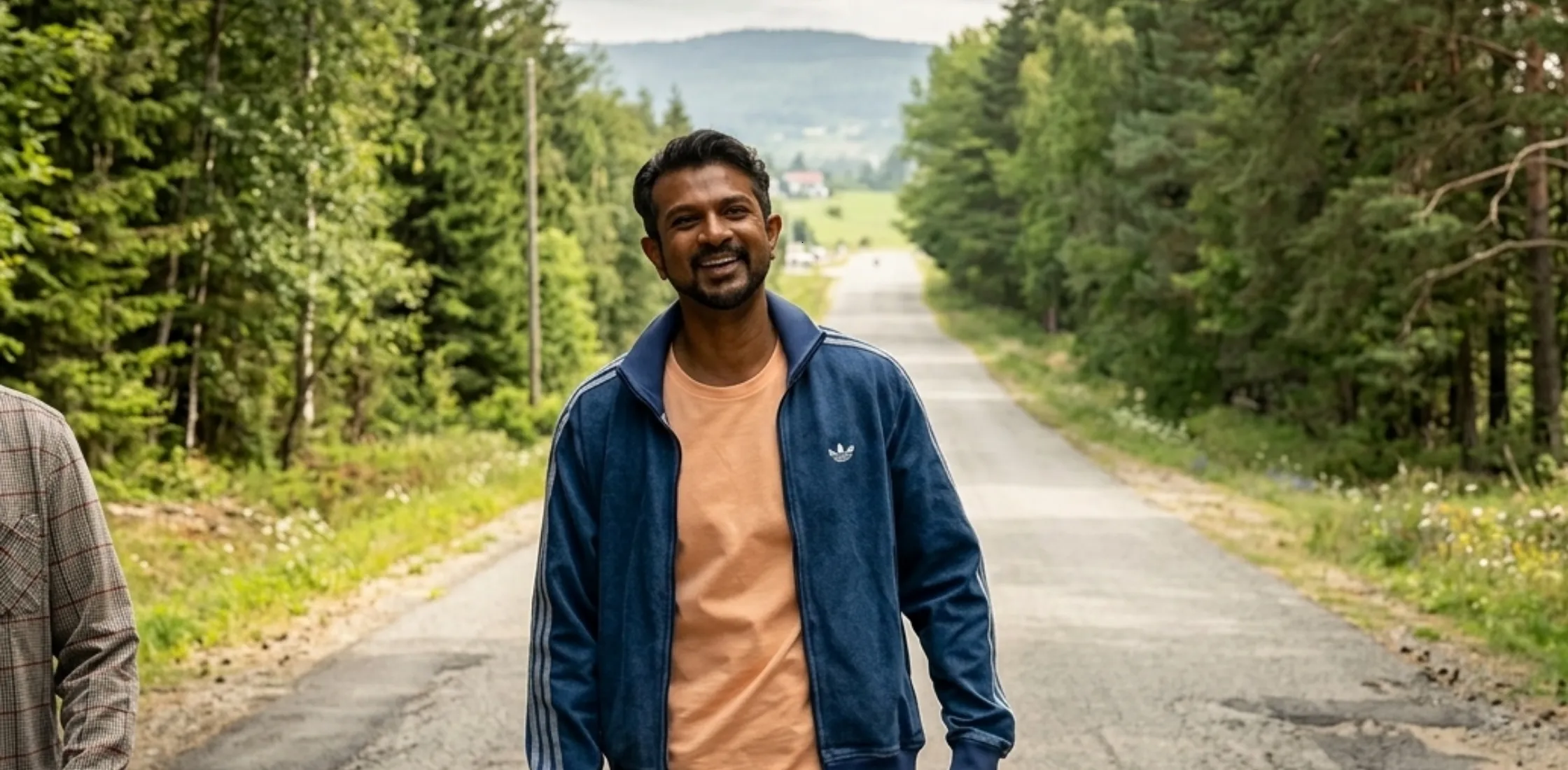 Utkarsh Ambudkar Ghosts Season 5 Jay Arondekar blue denim jacket with white striped sleeves, stand collar, zipper front, and ribbed cuffs.