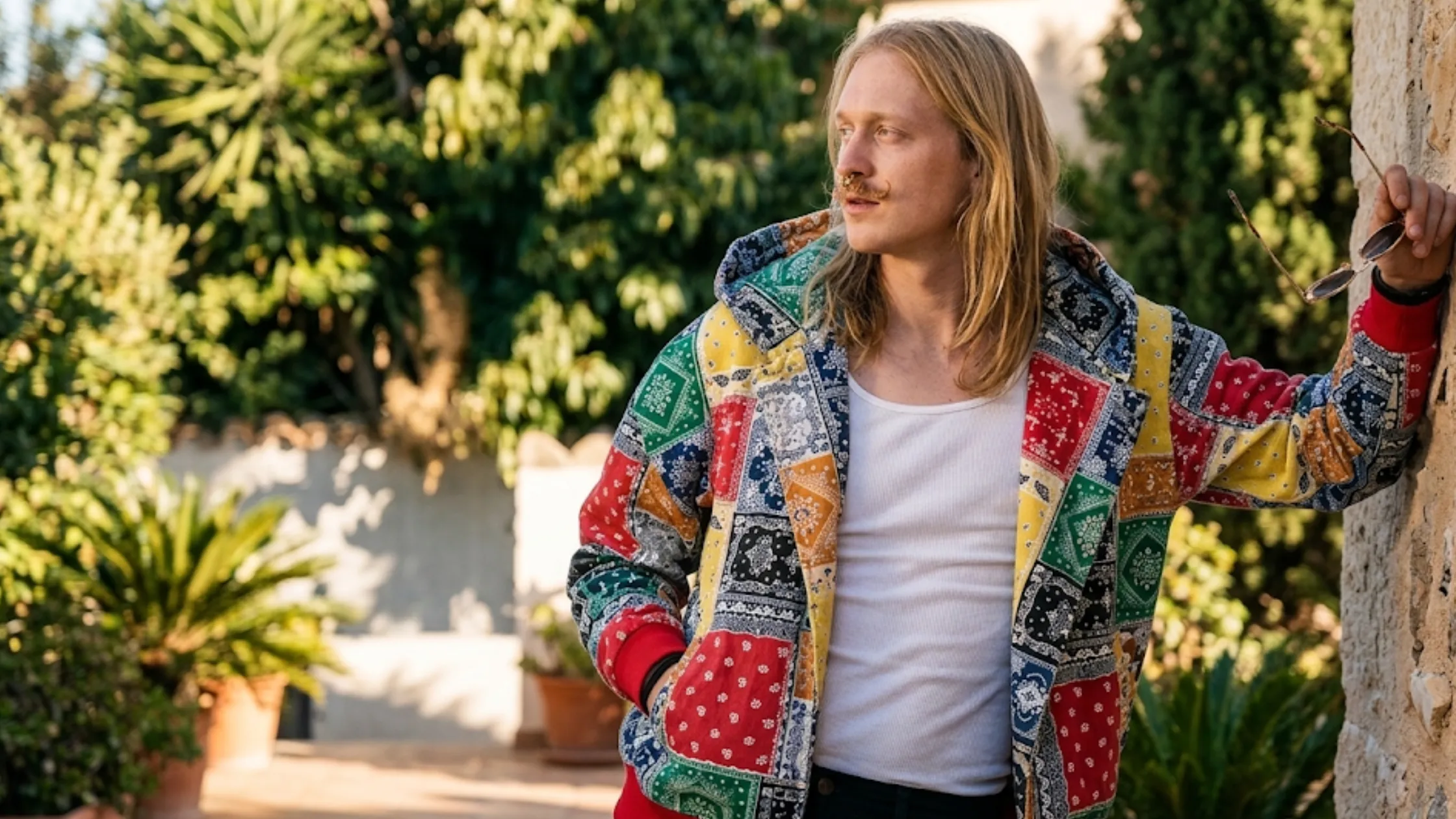 Euphoria S03 Daeg Faerch multi-color patchwork bandana hoodie with oversized fit, paisley graphics, drop shoulders, and red ribbed trims