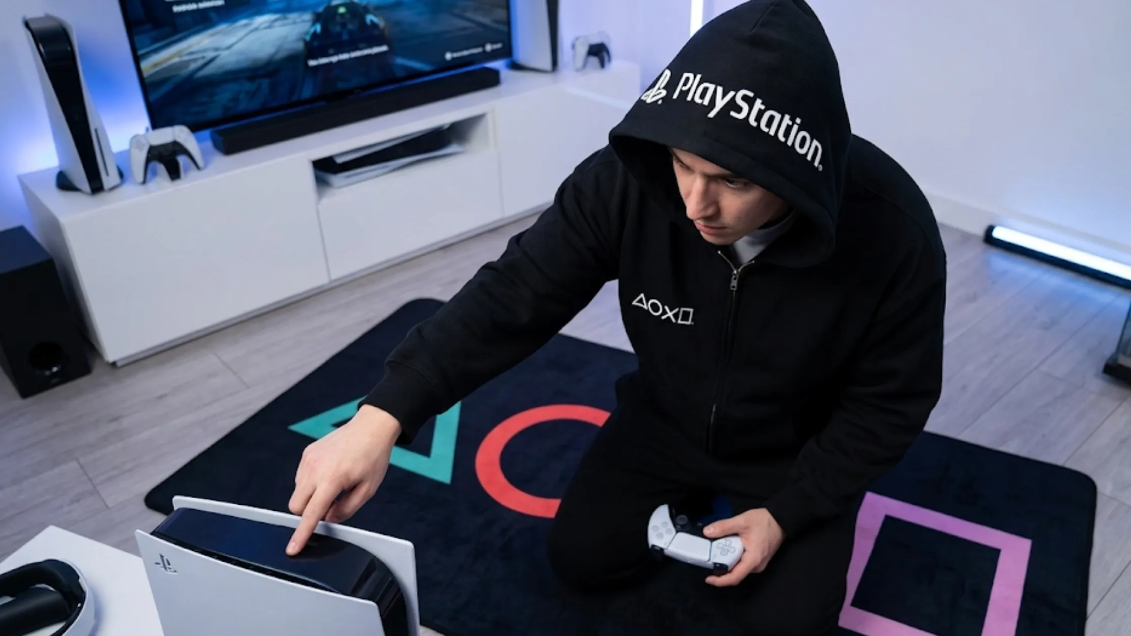 PlayStation black oversized zip hoodie with white PlayStation logo, controller button chest graphics, full zipper, and fleece fabric
