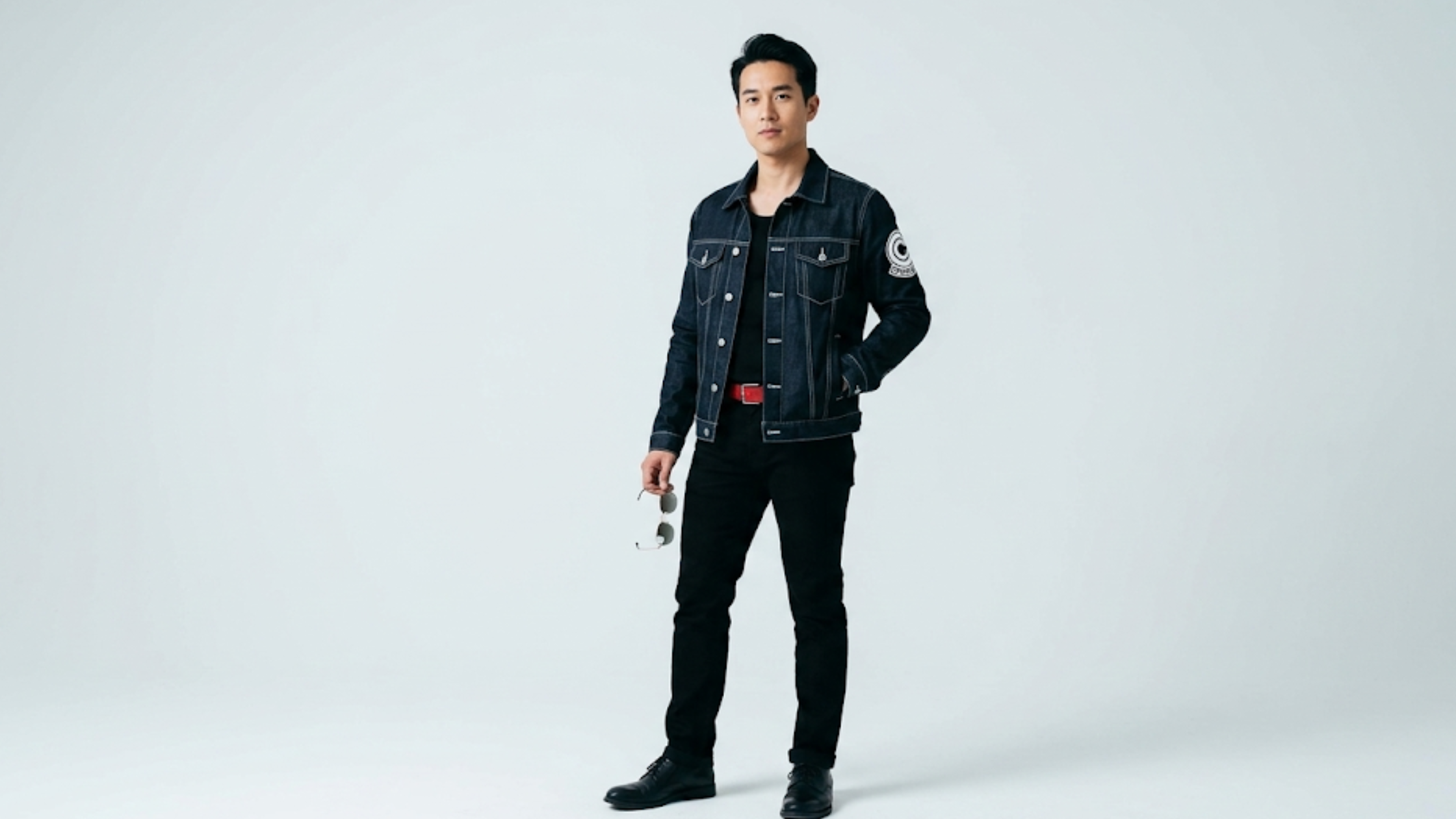 Dragon Ball Z Future Trunks blue cropped denim jacket with Capsule Corporation sleeve patch, chest flap pockets, and contrast white stitching