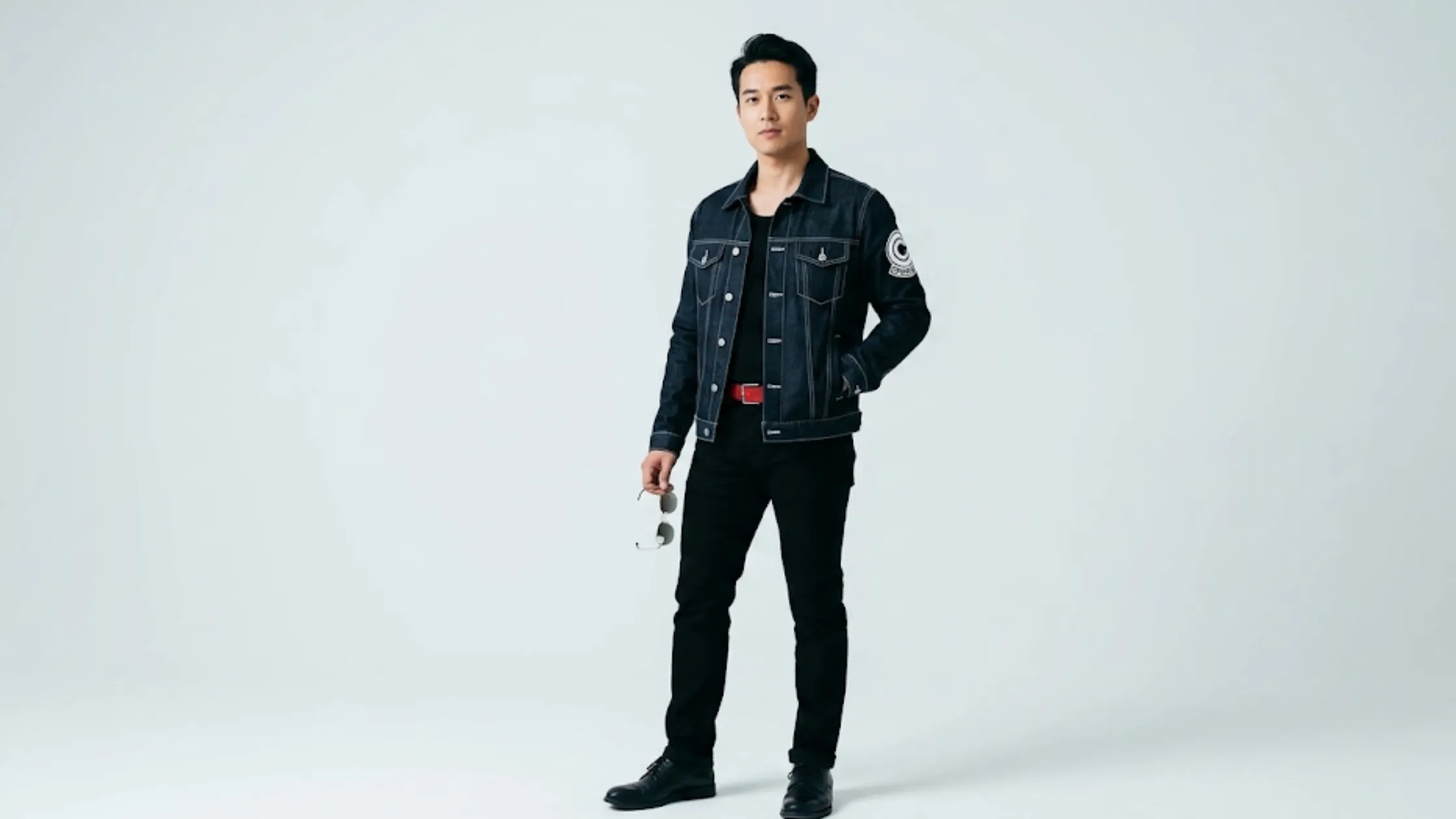 Dragon Ball Z Future Trunks blue cropped denim jacket with Capsule Corporation sleeve patch, chest flap pockets, and contrast white stitching