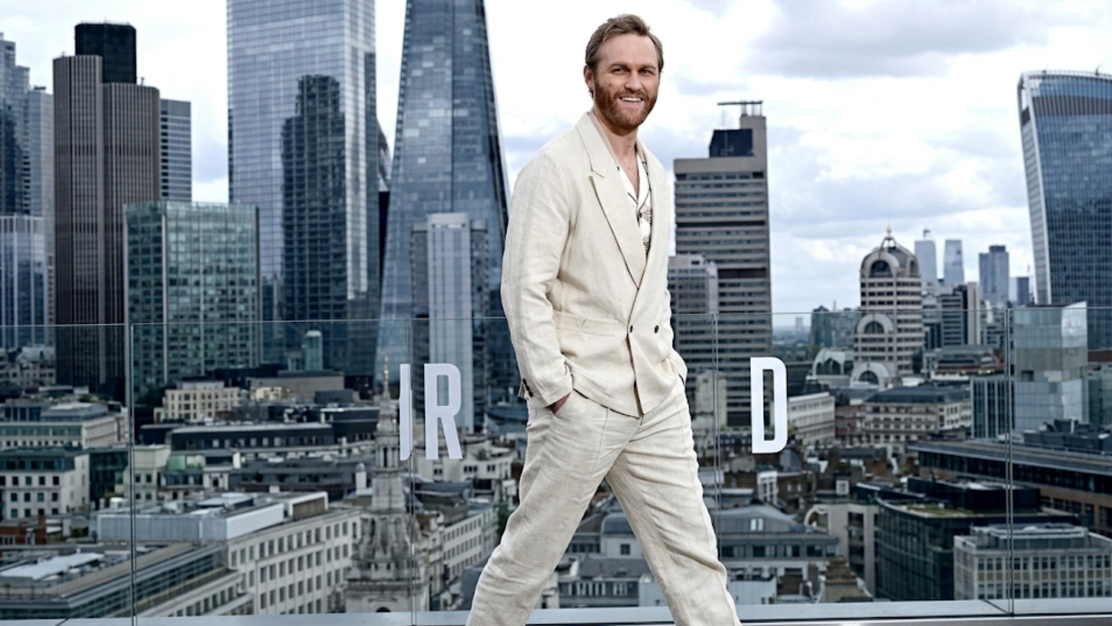 Wyatt Russell Disclosure Day Rose Court London 2026 cream double-breasted linen blazer photocall look