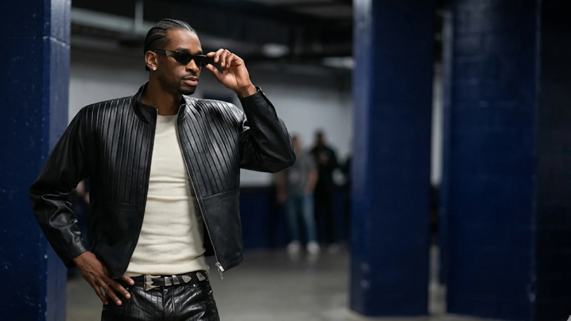 Shai Gilgeous-Alexander wearing the black quilted ribbed leather jacket with a stand collar and padded shoulders during a pre-game tunnel walk.