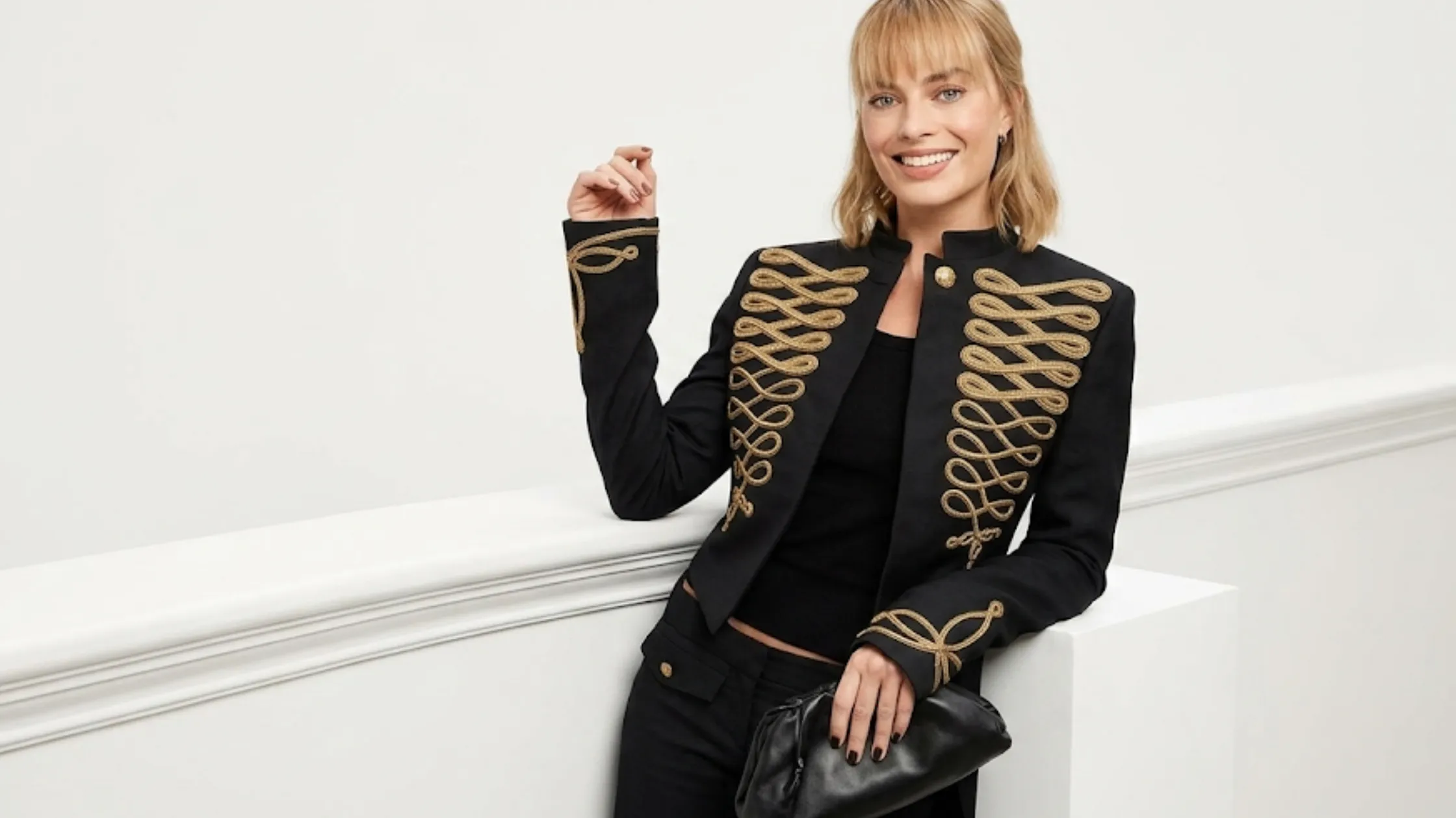 Margot Robbie black military jacket Alexander McQueen SS26 gold frogging cropped tailcoat