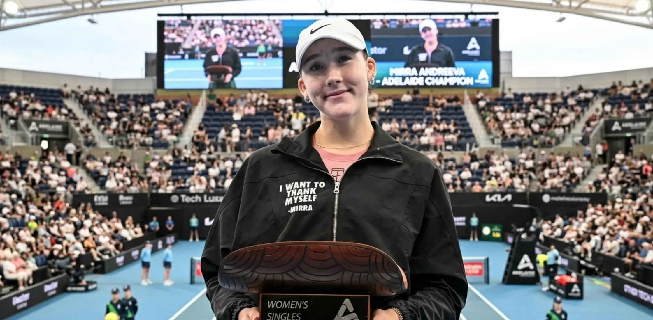 Mirra Andreeva 2026 Adelaide International black denim track jacket with gold buttons, chest pockets, and peplum silhouette design