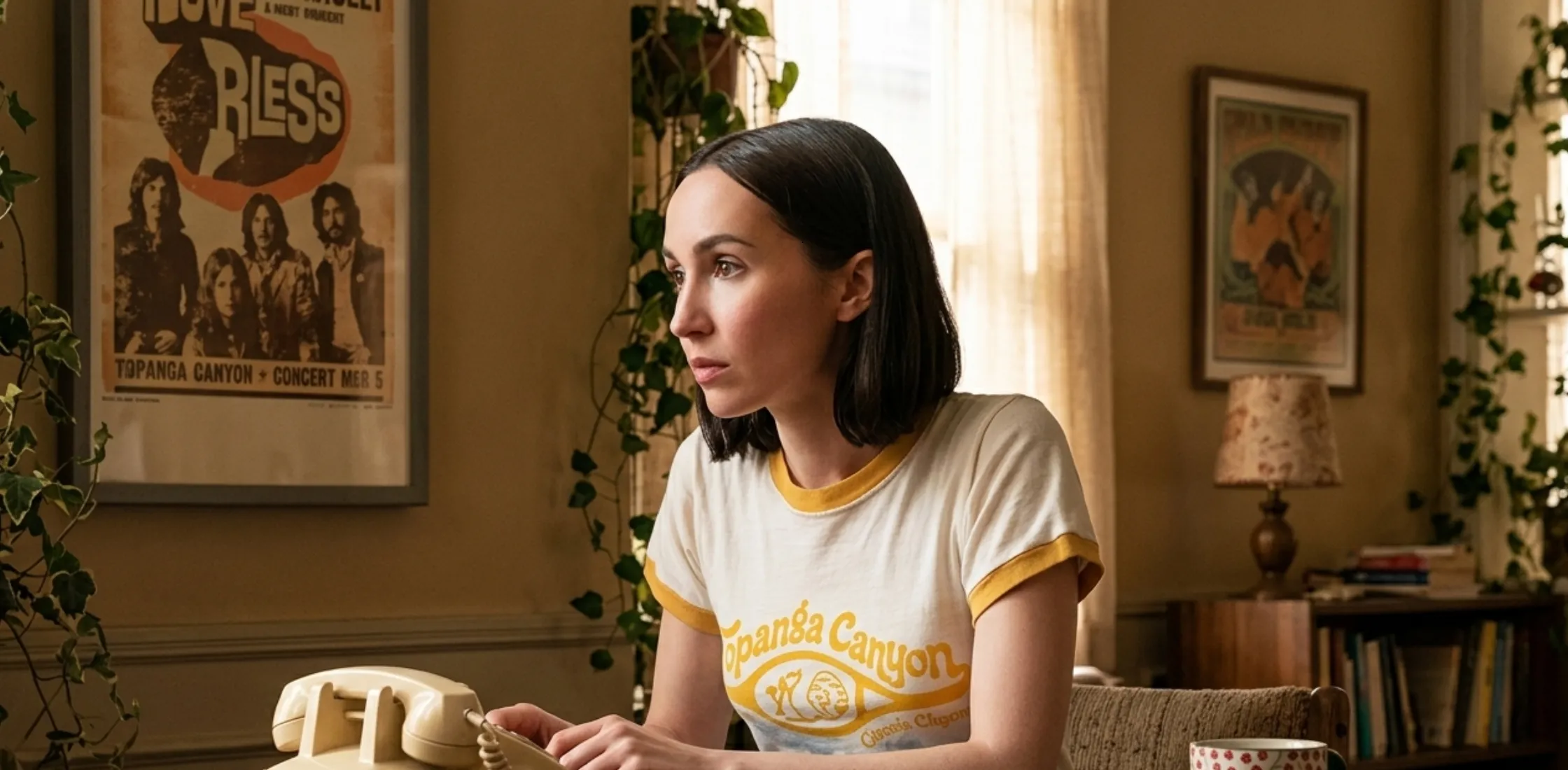 Lexi Howard wearing Laurel Canyon Tennis Club white ringer T-shirt with yellow trim and retro graphic design in Euphoria Season 3