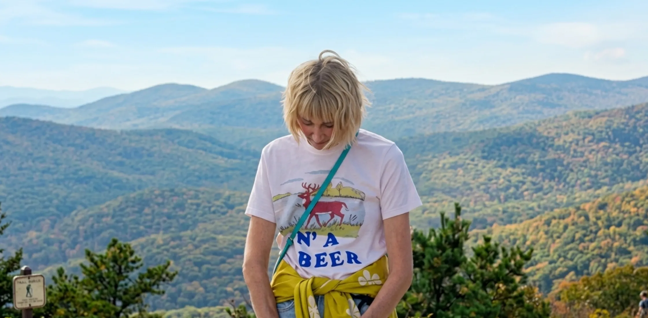 Four Seasons S02 Kerri Kenney Buck N’ A Beer graphic white T-shirt with vintage deer illustration indie outdoor style