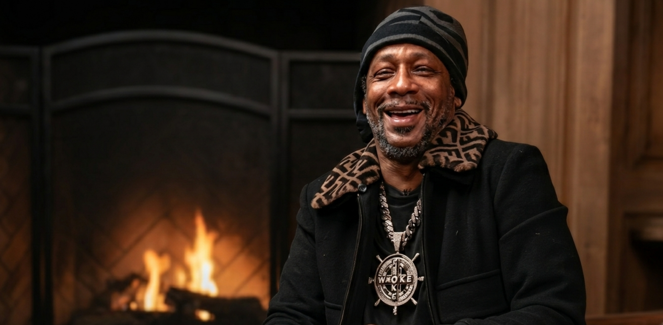 Katt Williams Fendi black bomber jacket with brown FF monogram collar styled in luxury streetwear look from viral Club Shay Shay interview