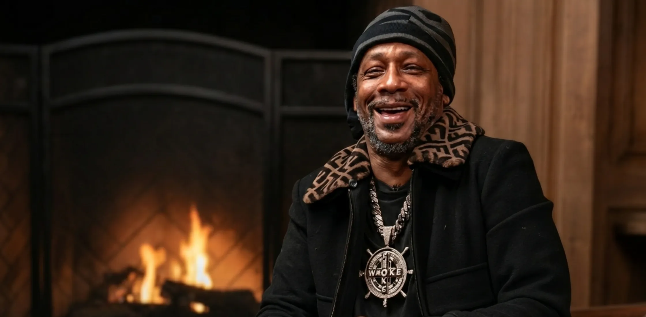 Katt Williams Fendi black bomber jacket with brown FF monogram collar styled in luxury streetwear look from viral Club Shay Shay interview
