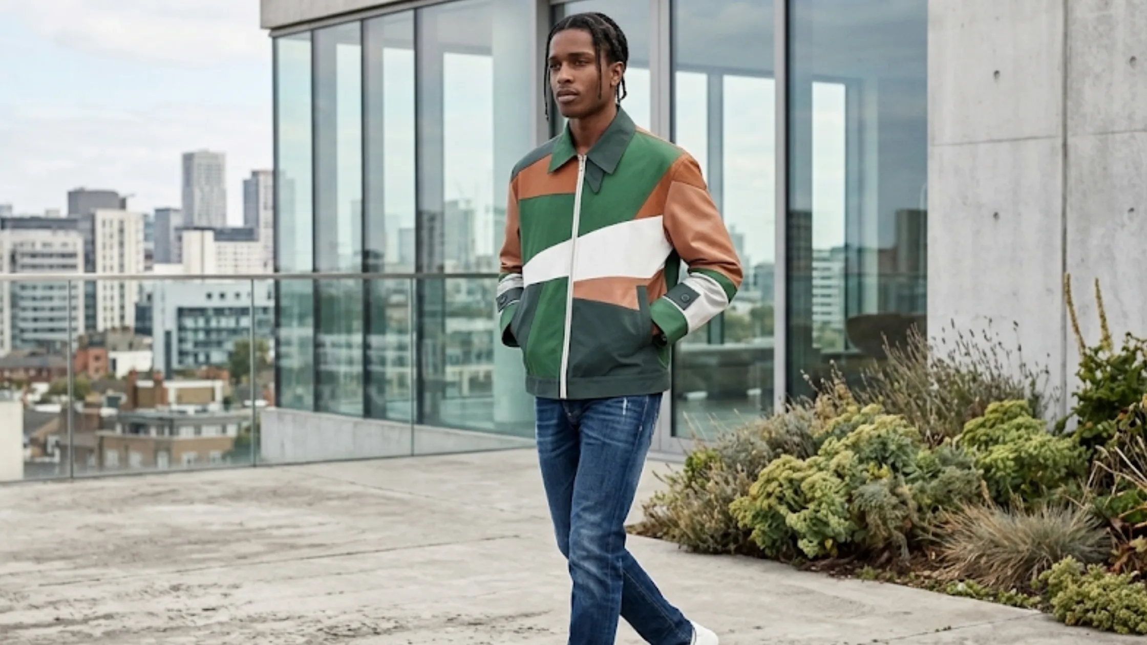 FIFA World Cup 2026 Mexico Jacket with geometric color-block design in green, terracotta, charcoal, and white tones, featuring a coach-style windbreaker silhouette.