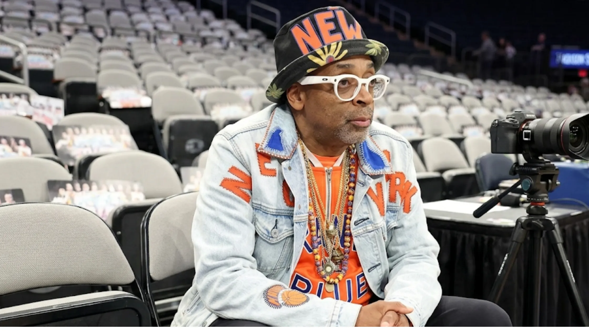 Spike Lee 2026 NBA Finals New York Knicks denim trucker jacket featuring light wash distressed denim, orange applique “NEW YORK” lettering, blue patchwork collar, and Knicks-inspired streetwear design.