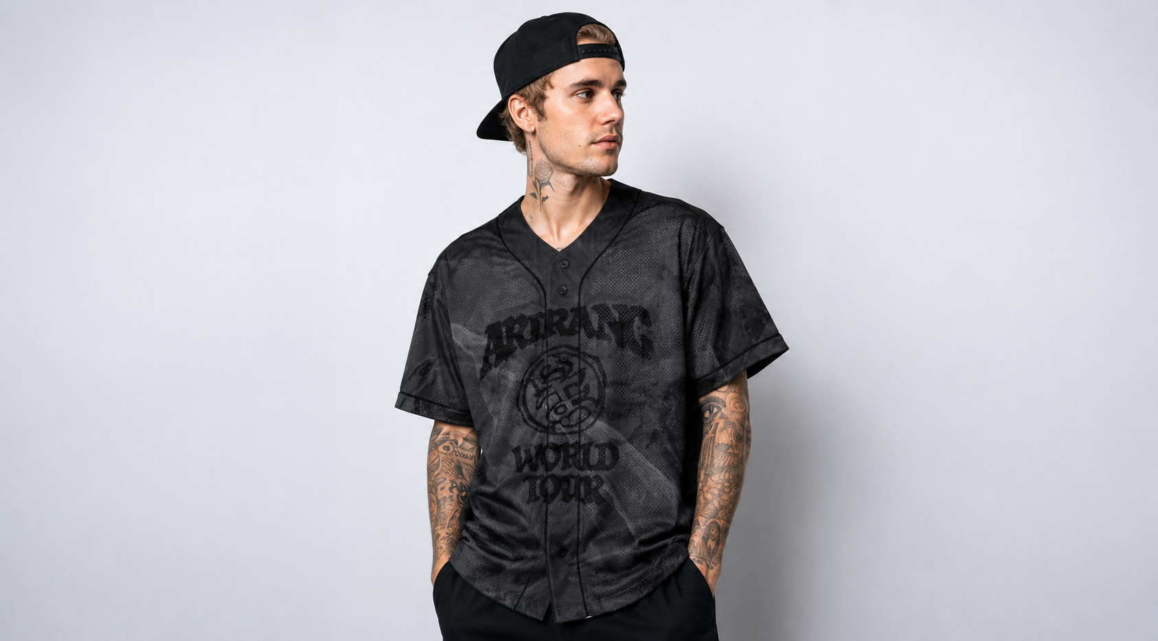 Charcoal grey V BTS Arirang World Tour baseball jersey with black piping, featuring “ARIRANG WORLD TOUR” front graphic, crest emblem, and back print with V and number 95 in a marble mesh design.