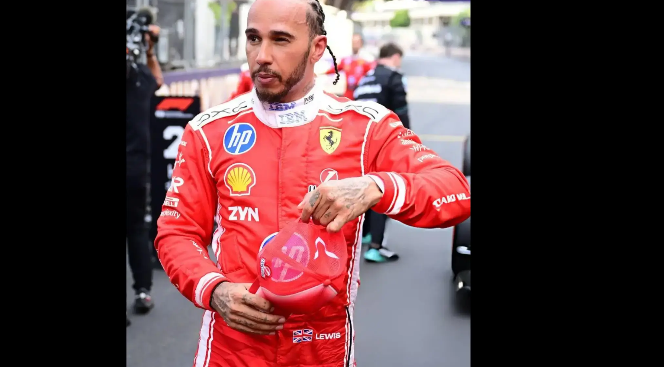 Lewis Hamilton wearing the red and white Ferrari F1 Grand Prix of Monaco racing jumpsuit with corporate sponsor logos, a white mock collar, and "LEWIS" name text.