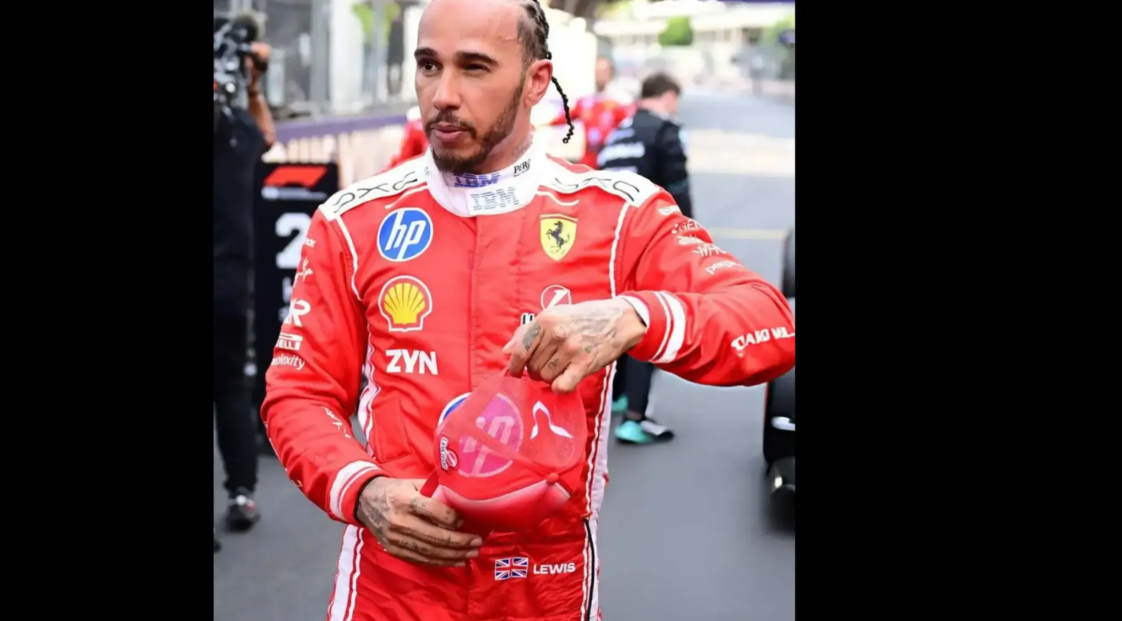 Lewis Hamilton wearing the red and white Ferrari F1 Grand Prix of Monaco racing jumpsuit with corporate sponsor logos, a white mock collar, and "LEWIS" name text.