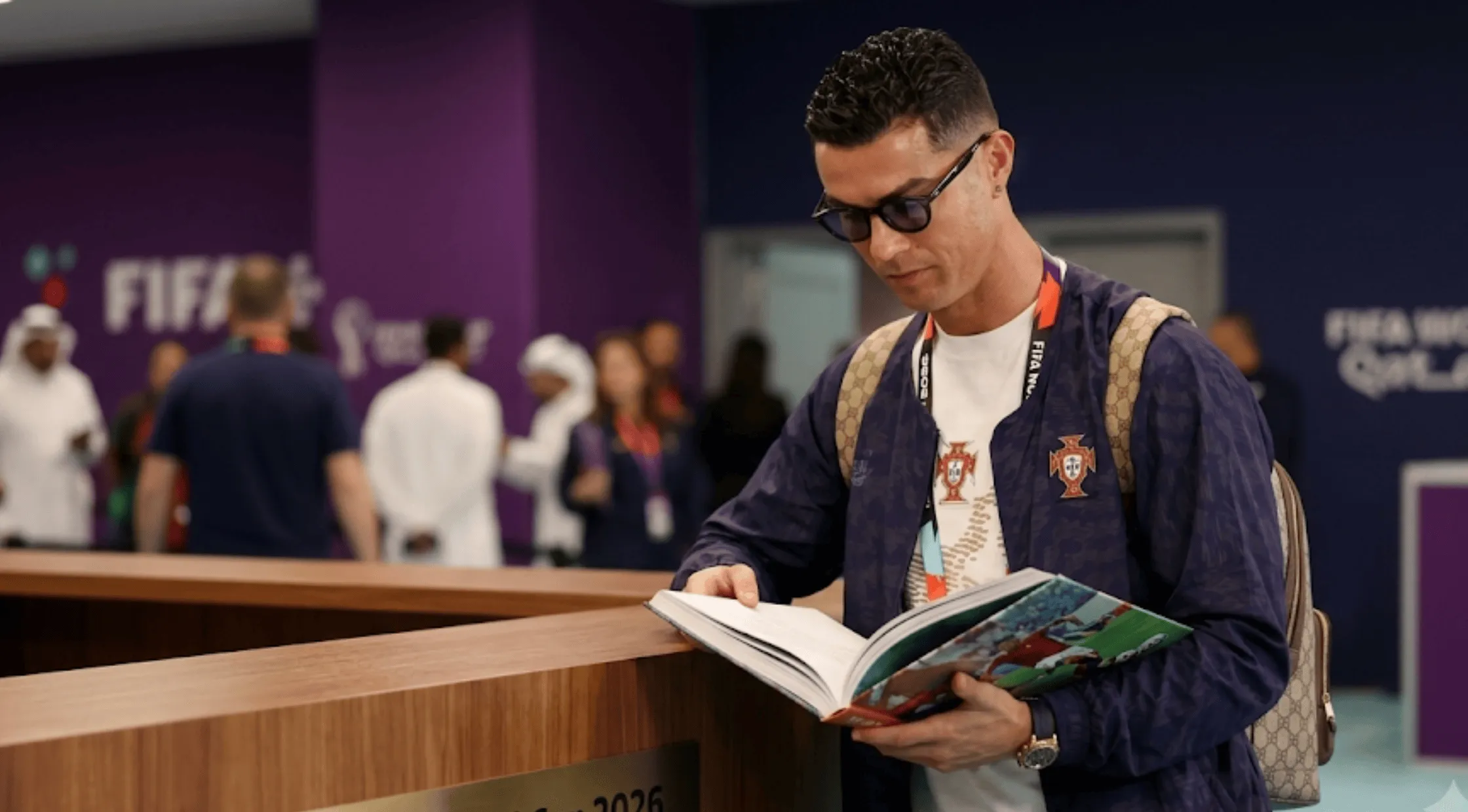Cristiano Ronaldo wearing the Portugal 2026 FIFA World Cup navy blue anthem track jacket with the official FPF crest.