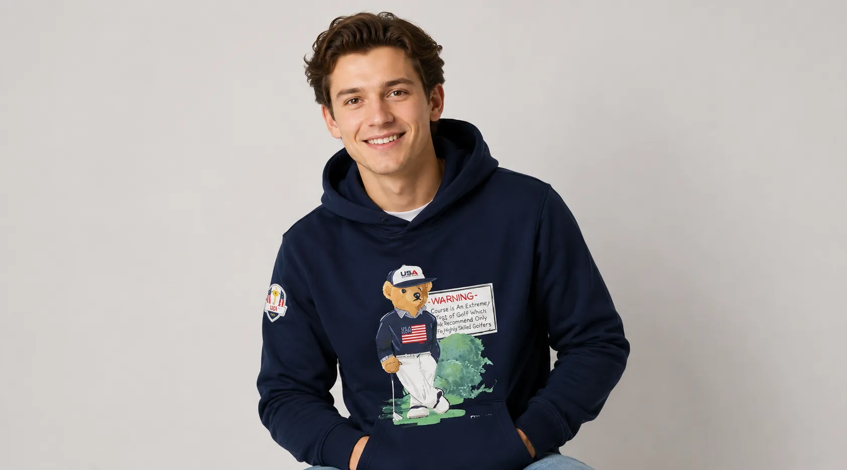 U.S. Ryder Cup Polo Bear Hoodie in navy blue with golf graphic, RLX logo, hooded design, and embroidered sleeve patch