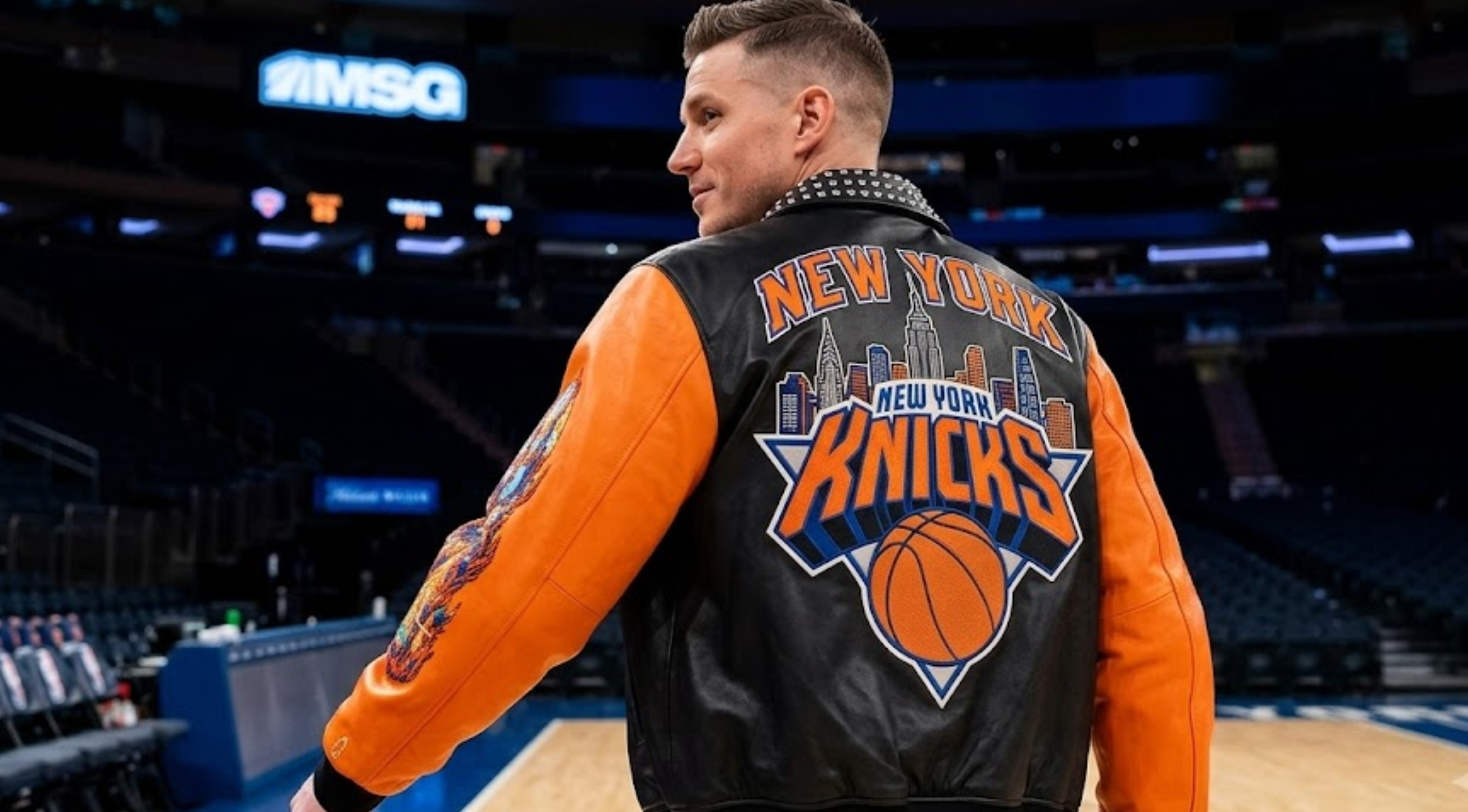 New York Knicks Championship 2026 black and orange leather varsity jacket with studded collar, Finals patches, and Statue of Liberty back graphic